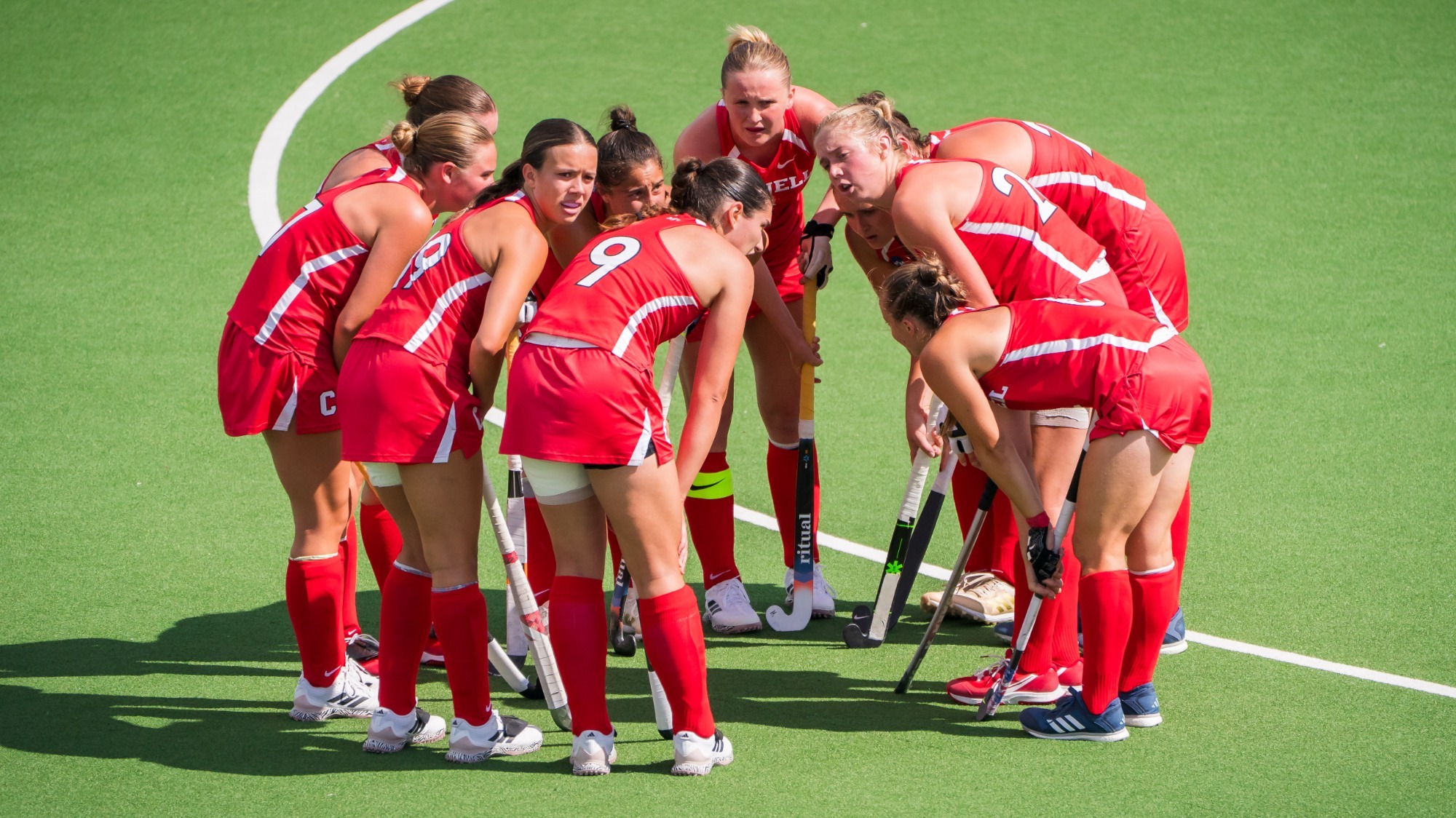 The Cornell field hockey team huddles during its 2026 scrimmage against Syracuse at Marsha Dodson Field in Ithaca, N.Y.