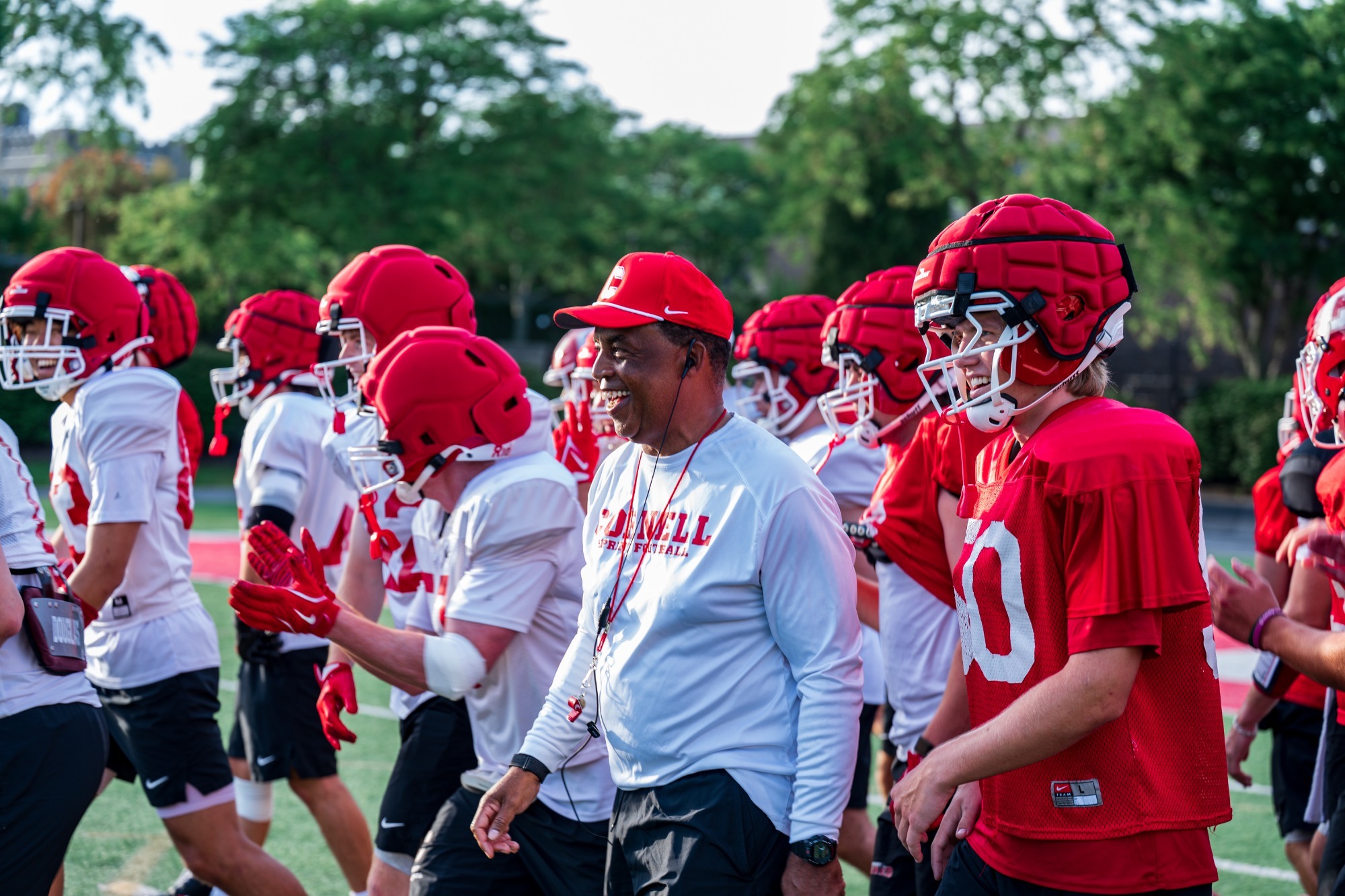 Head Coach Michael Huyghue and team