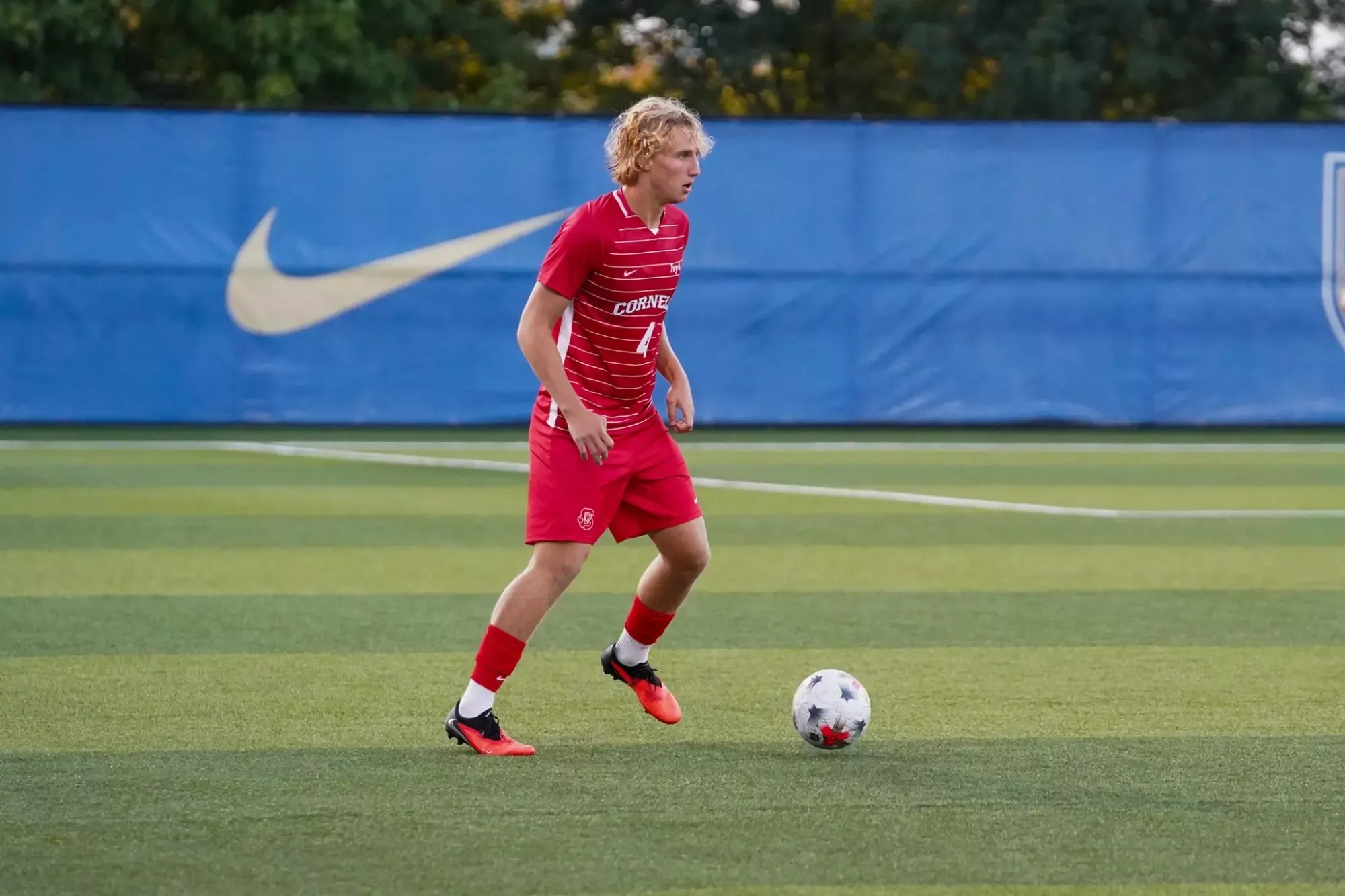 Freshman Lennon Harrington dribbling the ball at Pitt