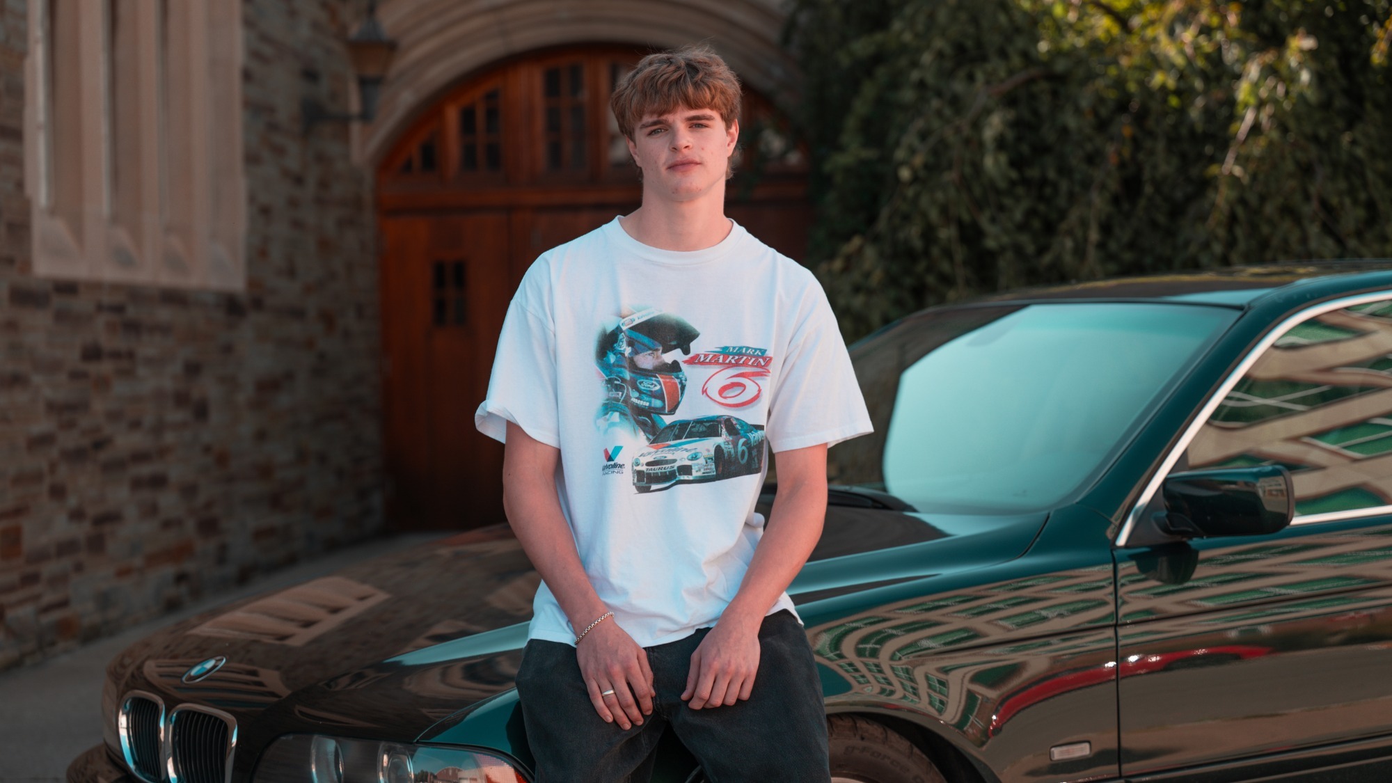 Blake Conway sits with his car in front of Teagle Hall during September of 2026.