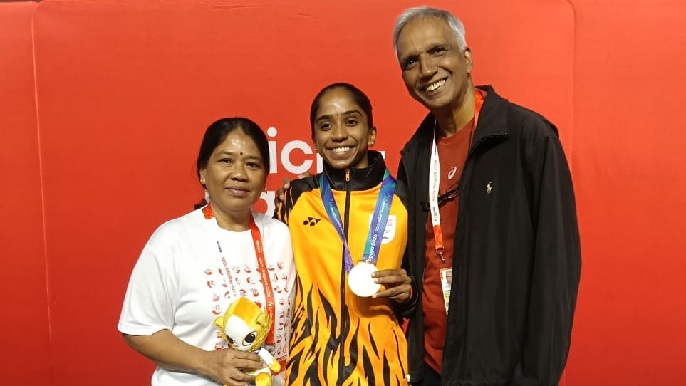 Sivasangari Subramaniam poses with her parents after successfully defending her gold medal at the 2026 Asian Games in Nagoya, Japan, on Sept. 27, 2026.