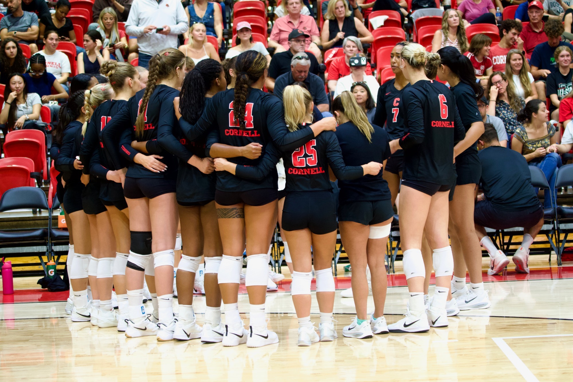 Cornell Volleyball huddles during match against Syracuse in Newman Arena