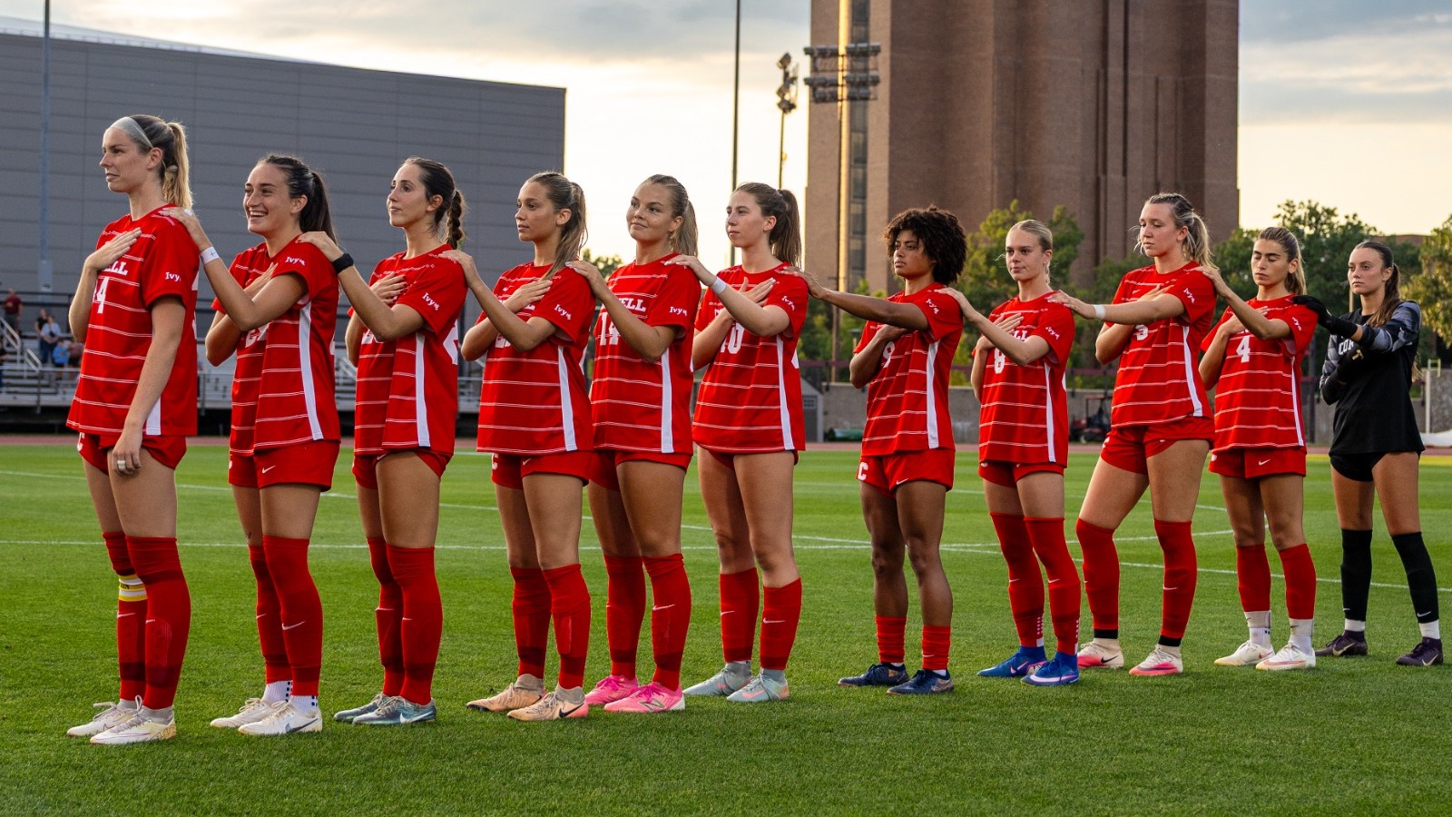 Members of the Cornell women's soccer team stand during the national anthem before a match during the 2026 season.