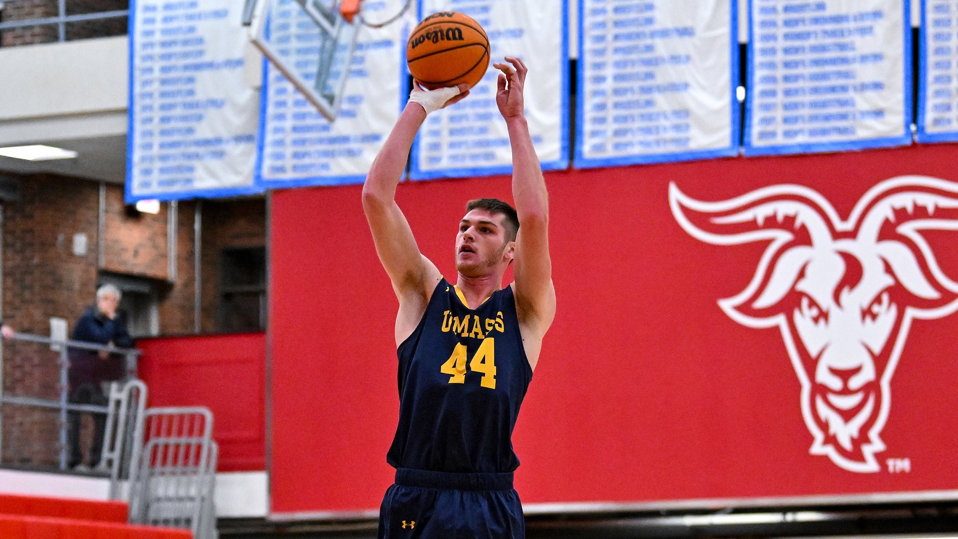 Cam Dunbury plays in a men's basketball game at WPI