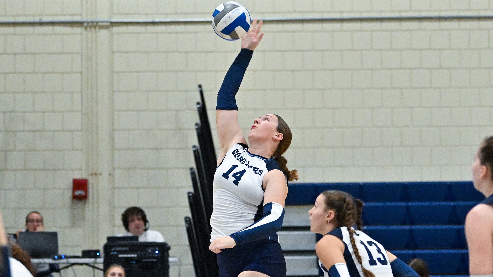 Olivia Seutter lays down a kill in a volleyball match
