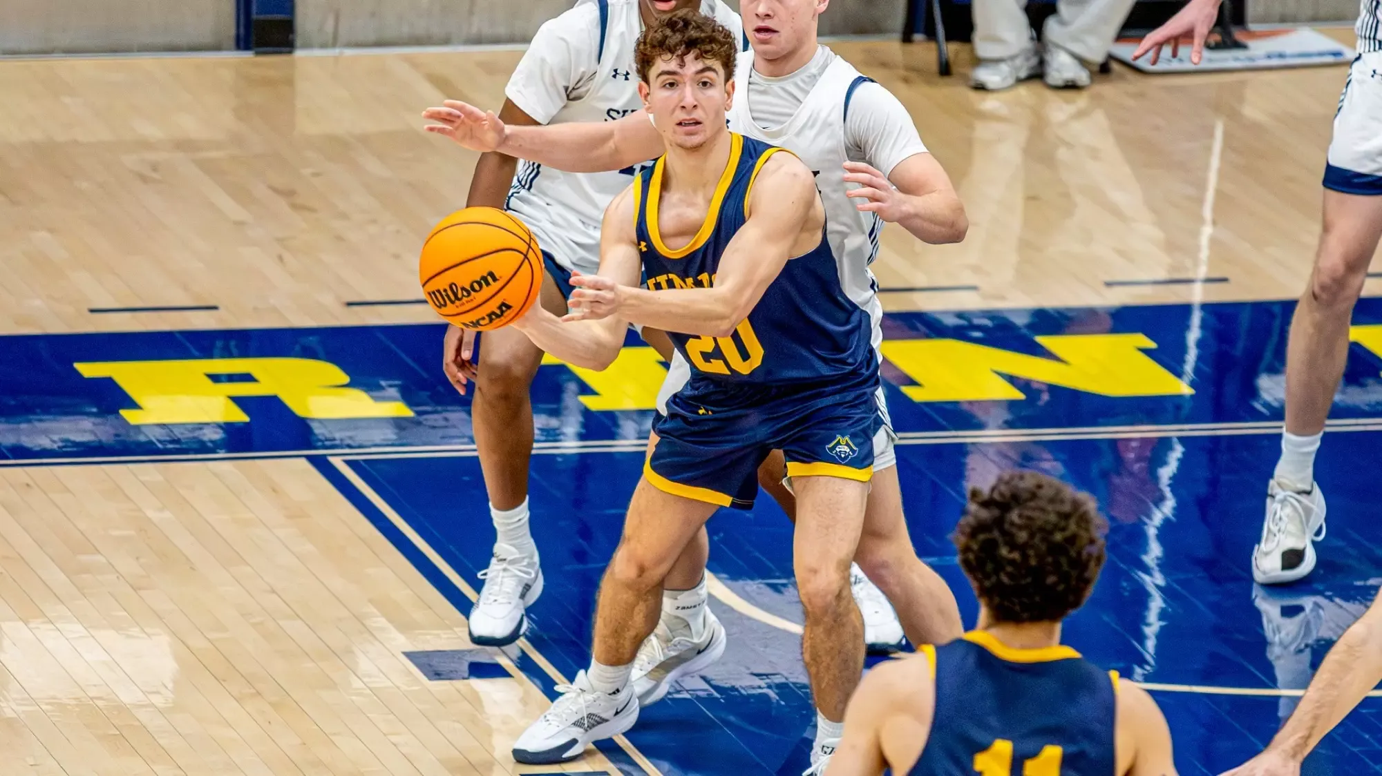 Photo of Camden DiChiara during a men's basketball game versus Suffolk