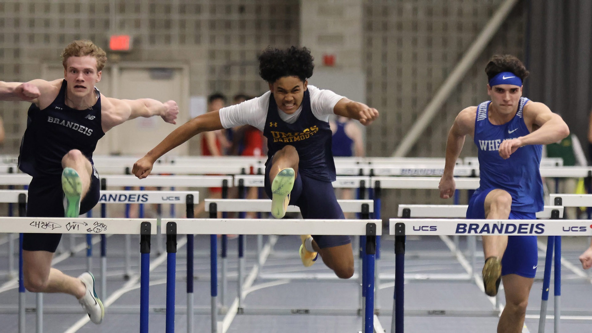 Jayden Francois competes in the 60-meter high hurdles at Brandeis