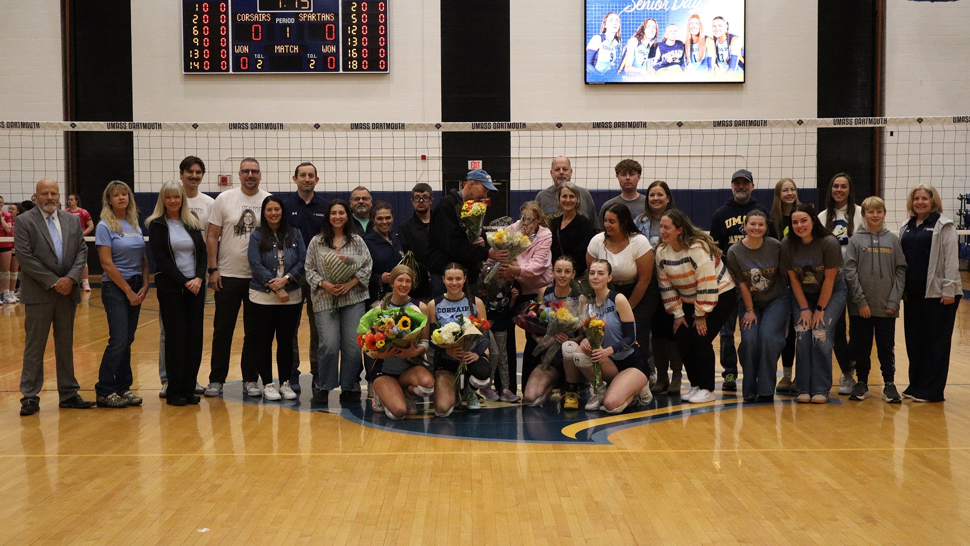 The Volleyball Seniors and their families pose after the Senior Day festivities on October 17 