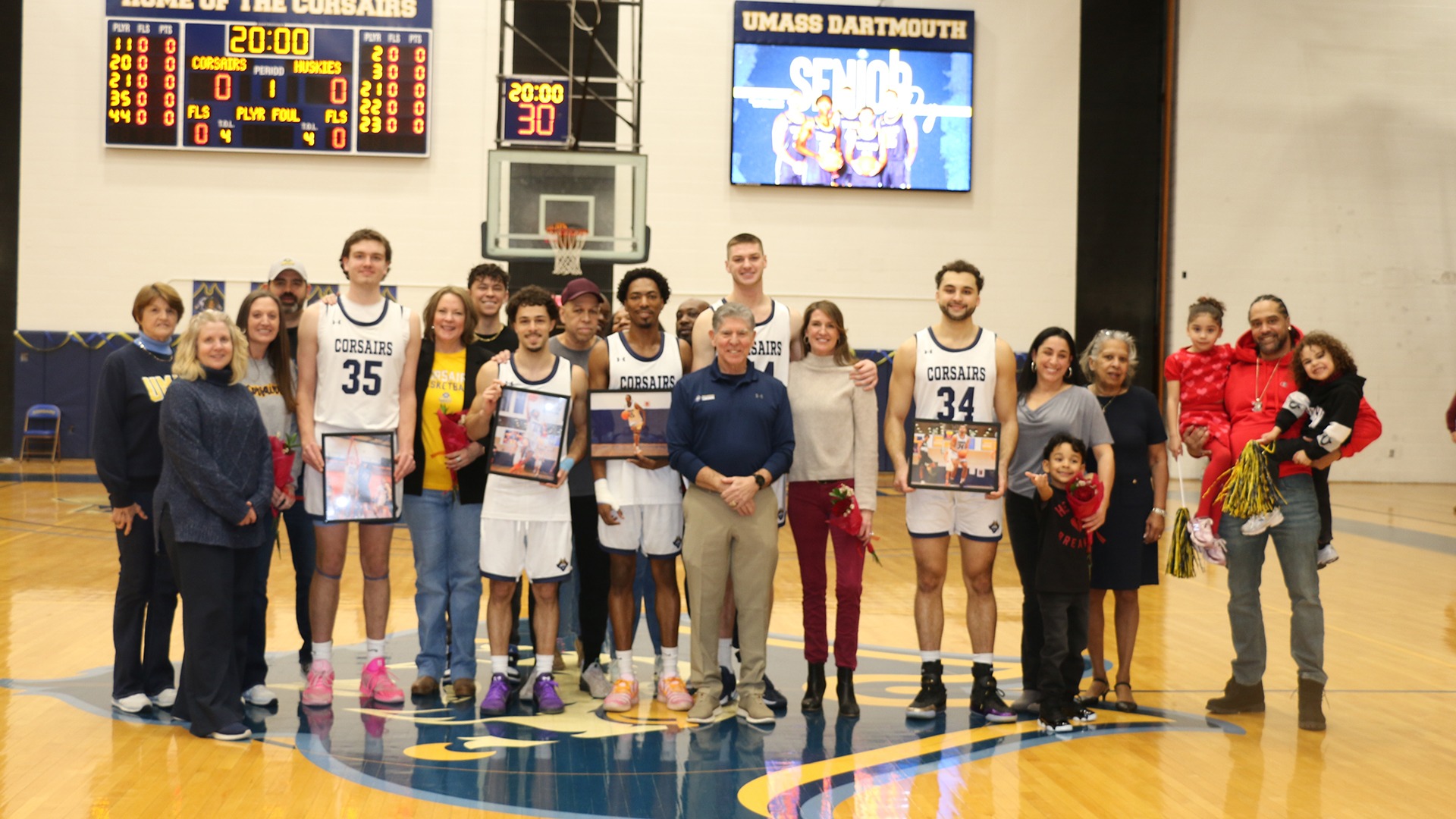 UMass Dartmouth Men's Basketball Seniors and their families during senior day ceremony - Feb. 14th