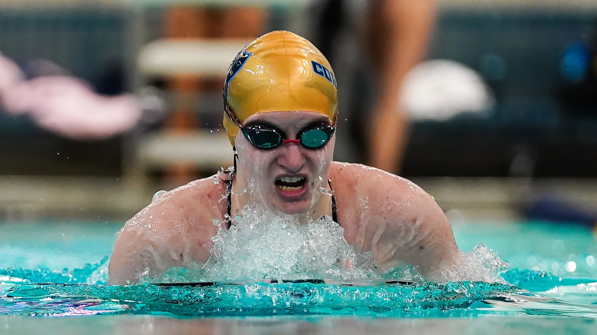 Kylie Winer competes in the breaststroke during a swim meet on January 24
