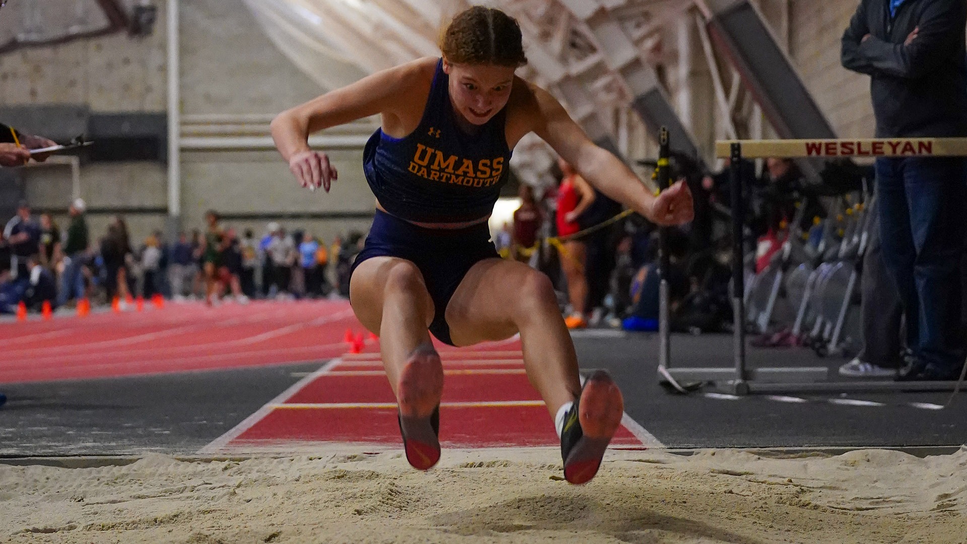 Eshaya Lauder competes in the long jump during an indoor track & field meet at Brandeis in 2026