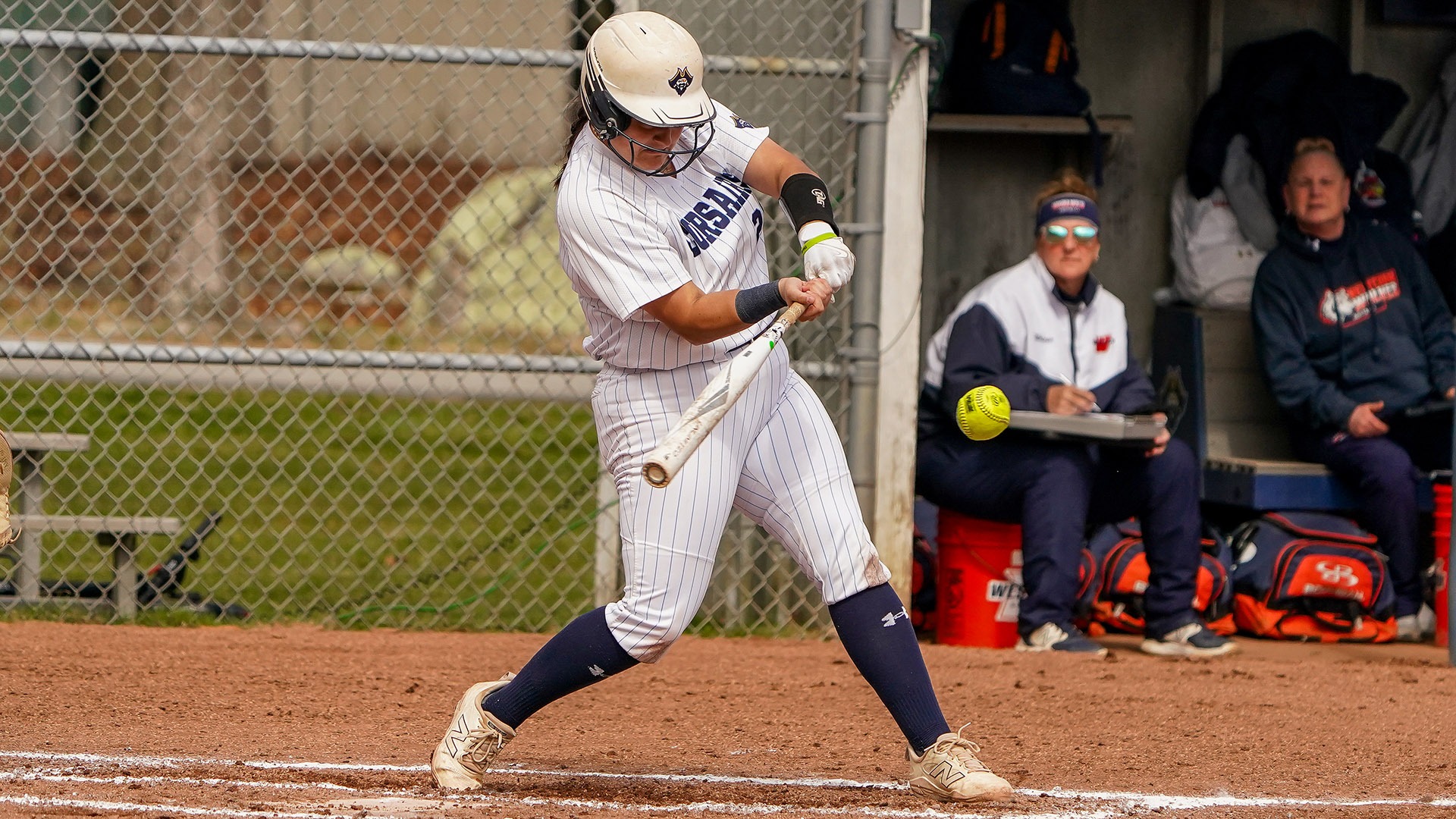 Olivia Silva swings the bat in a softball game during the 2025 season