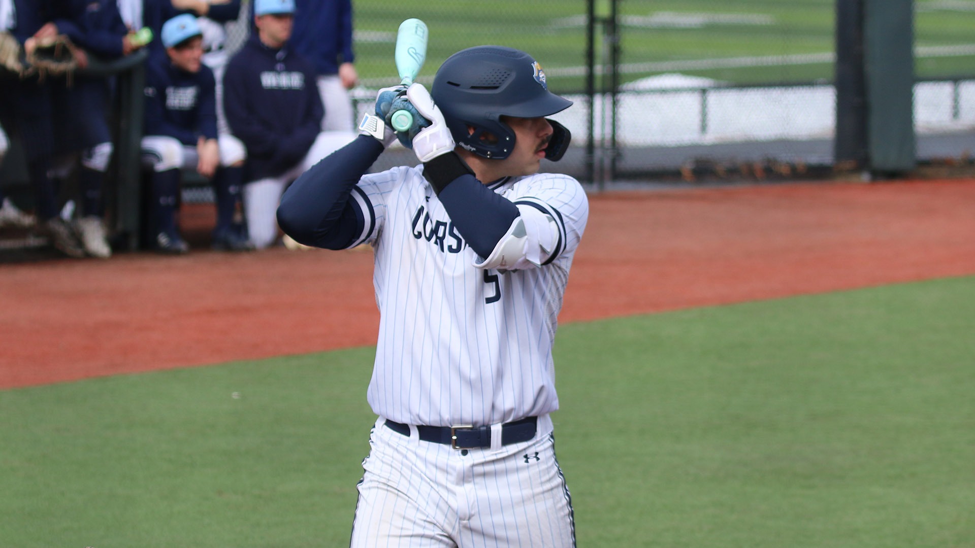Luc Nivaud bats during a game against SUNY Brockport on March 8, 2026
