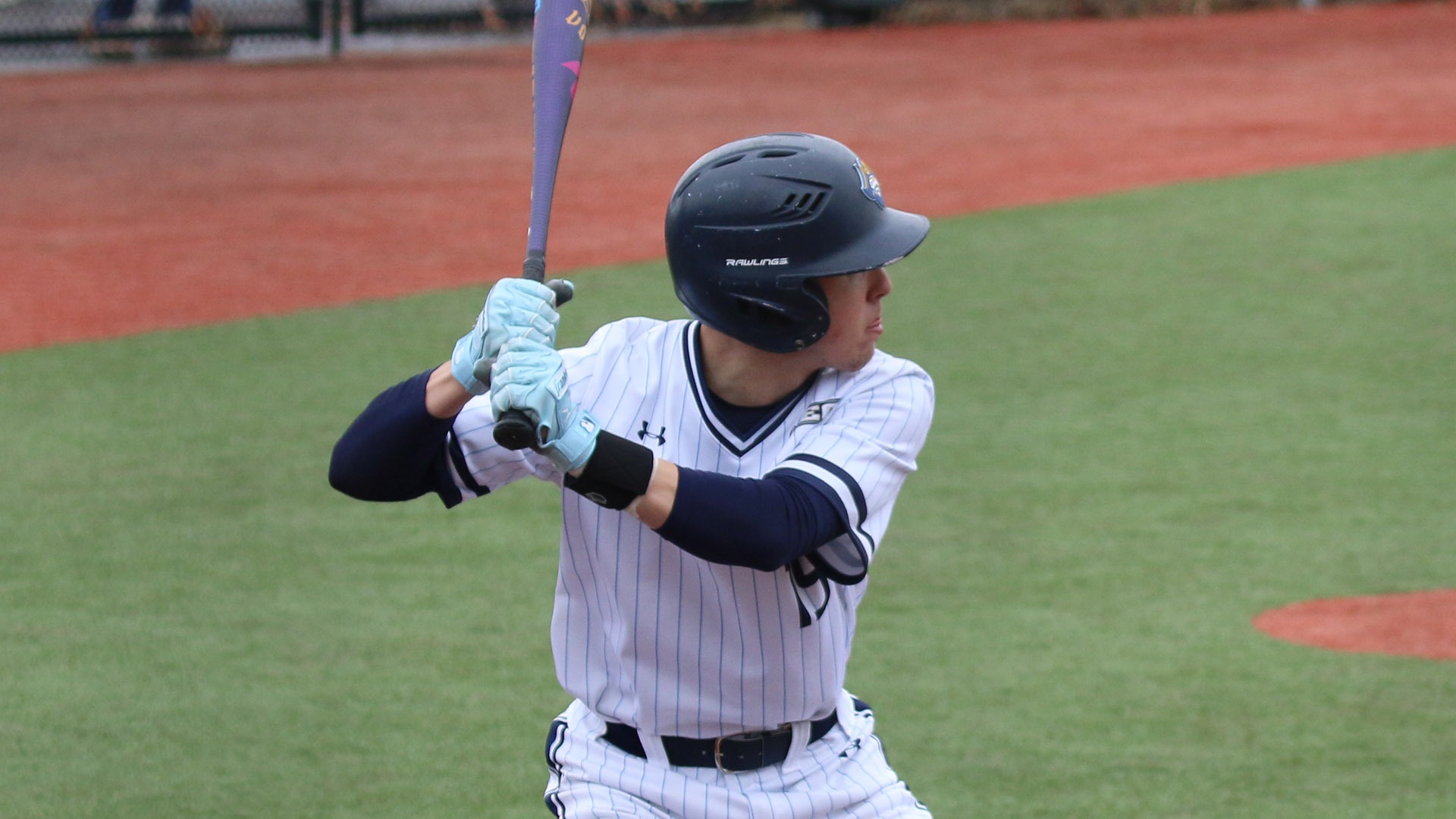 Jayden Cruz bats against SUNY Brockport in a game on March 8, 2026