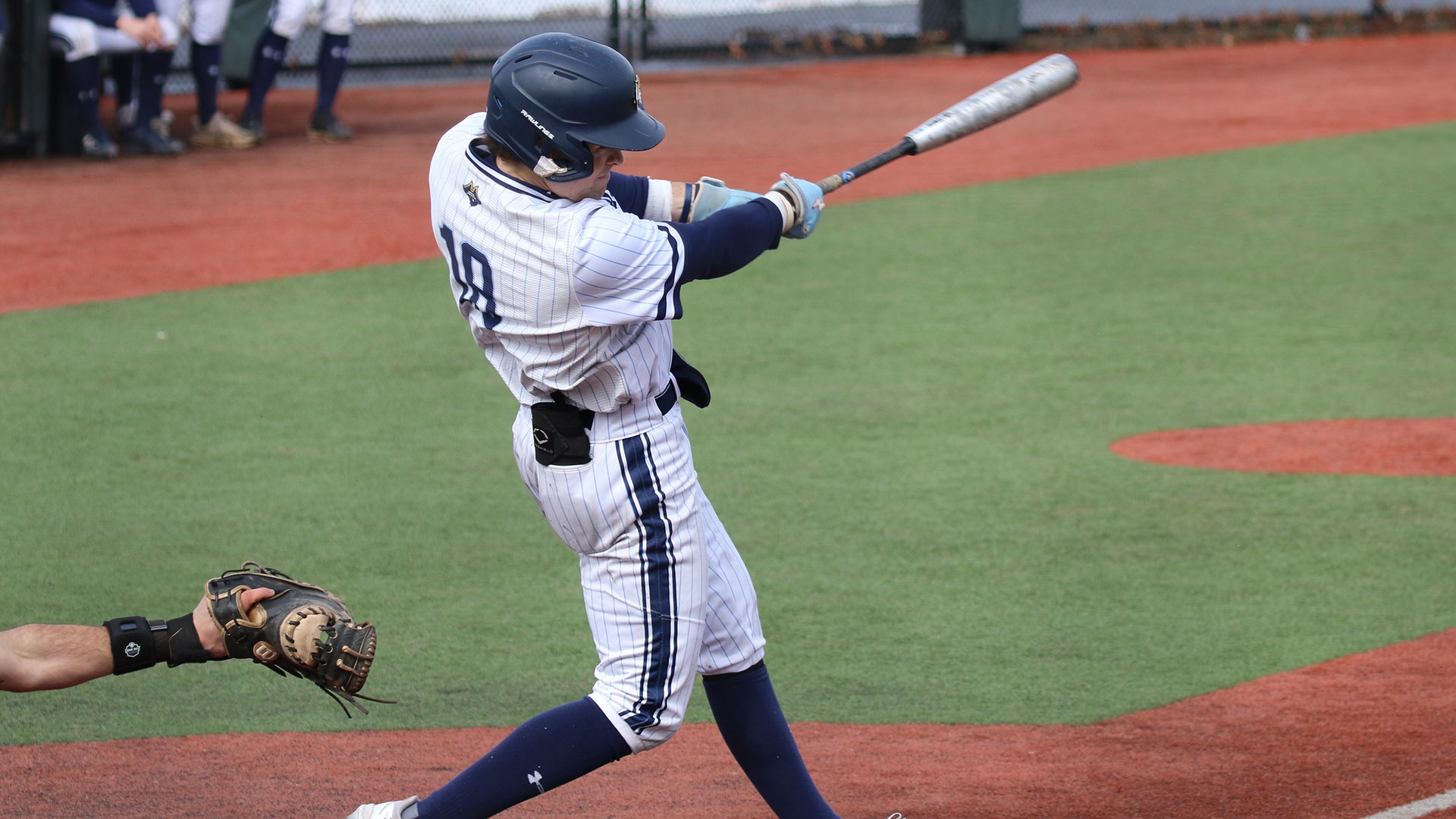 Sam Bradford swings at the plate during a baseball game against SUNY Brockport - March 8, 2026