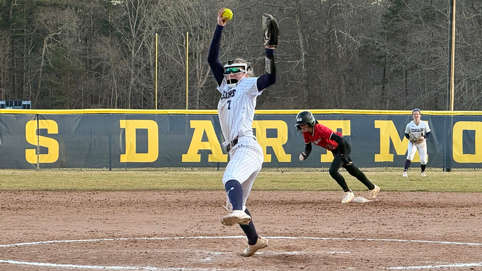 Brielle Kenney throws a pitch during a softball game against Bridgewater State
