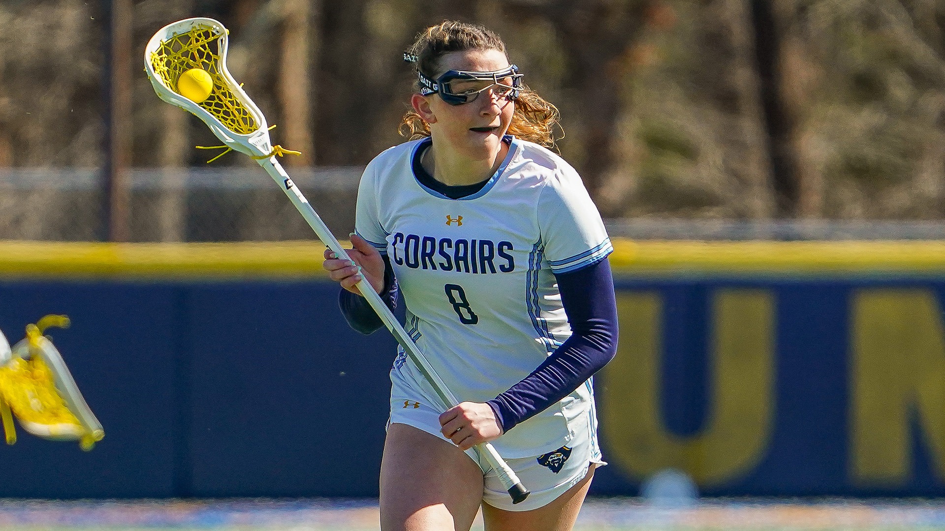 Maddy Allen competes in a women's lacrosse game against Regis College - March 2026