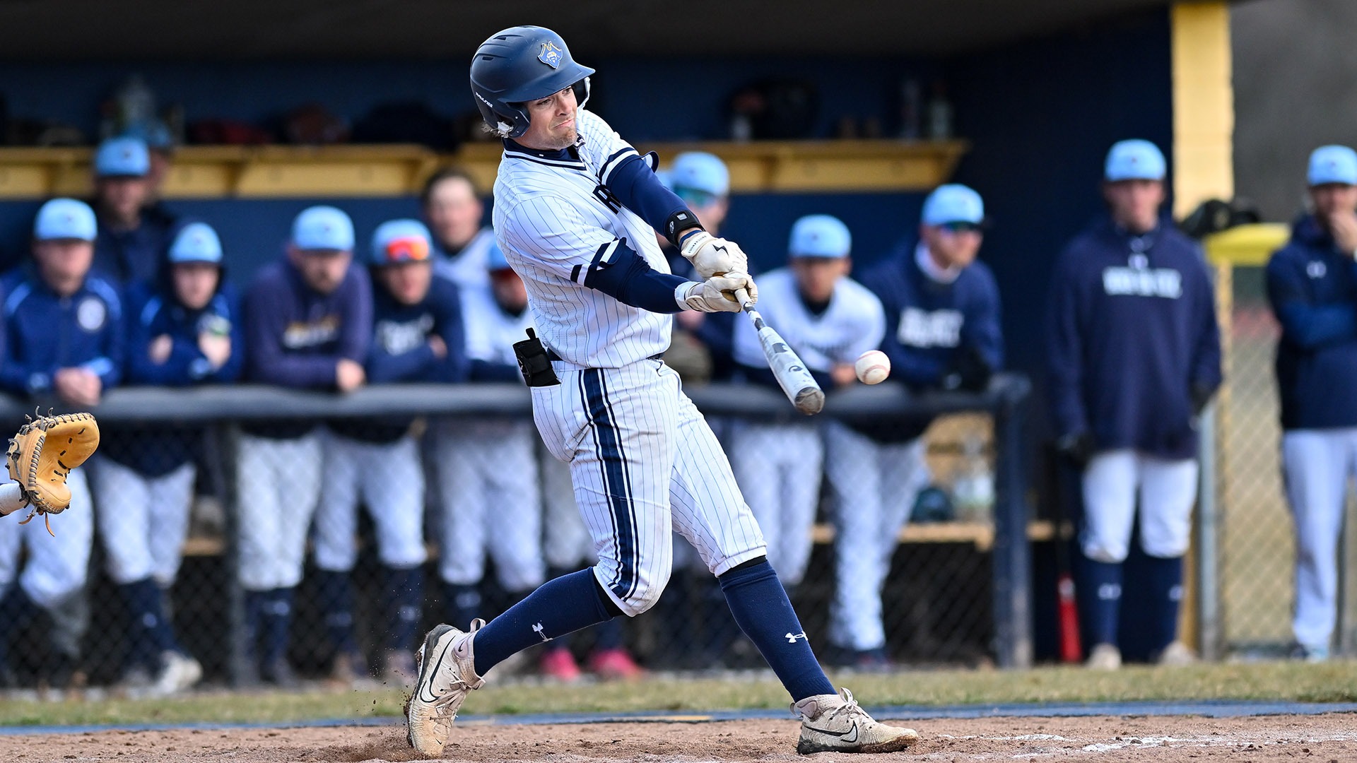 Sam Bradford swings the bat in a plate appearance against Southern Maine - Baseball