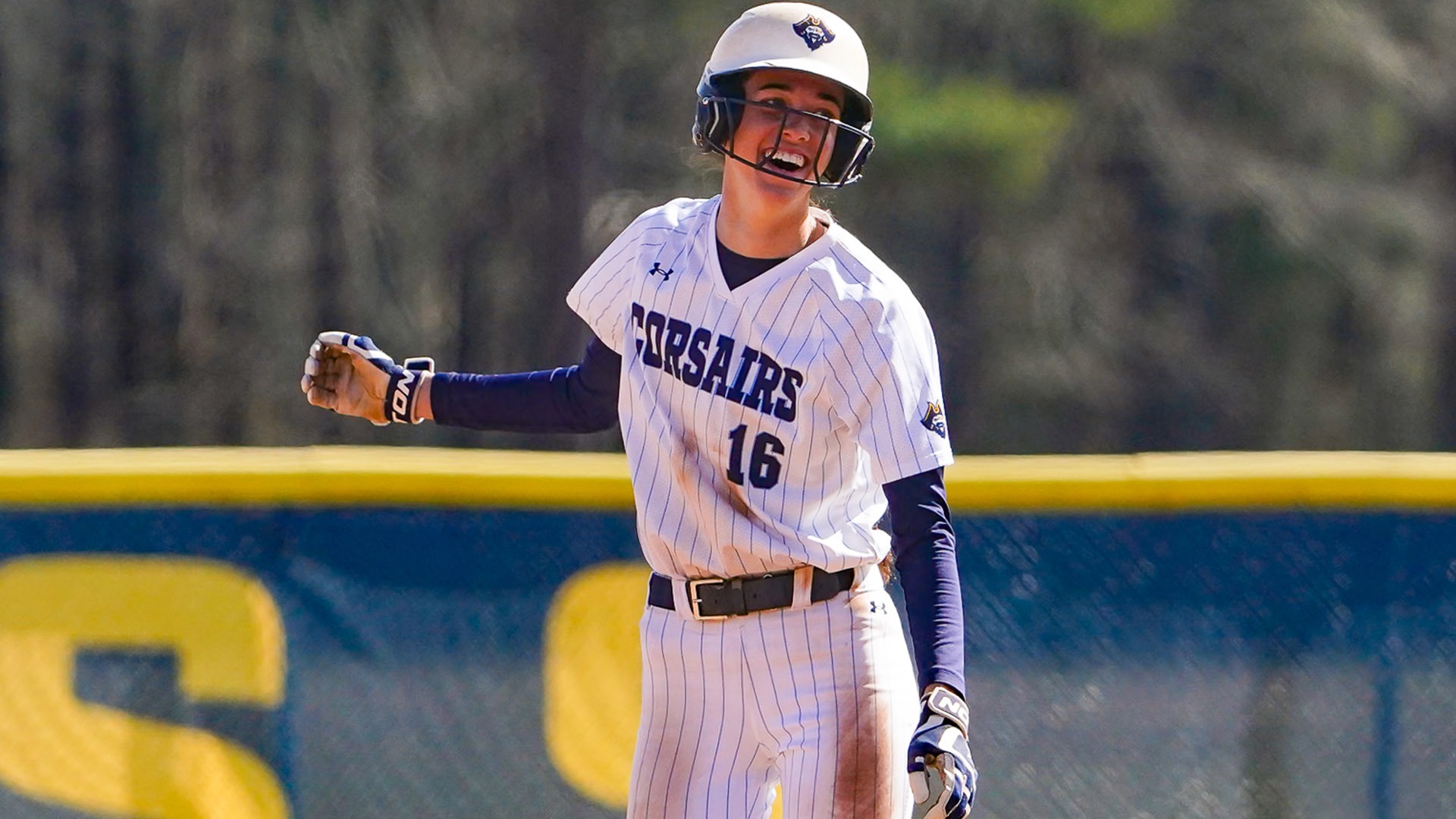 RaeLynn Perregaux smiles at second base after hitting a double against Bridgewater State - March 2026