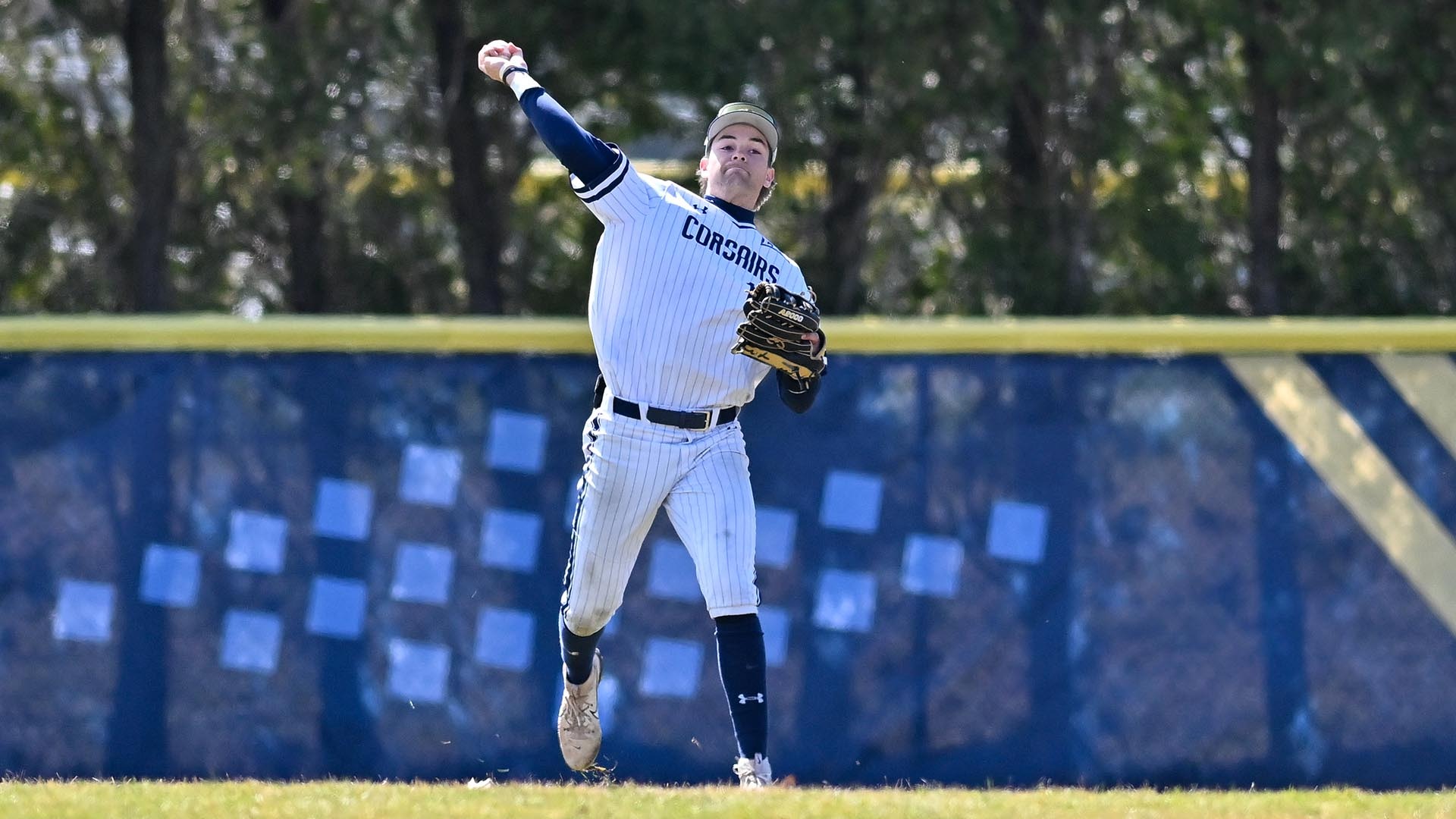 Sam Bradford throws the ball from right field in a baseball game - March 21, 2026