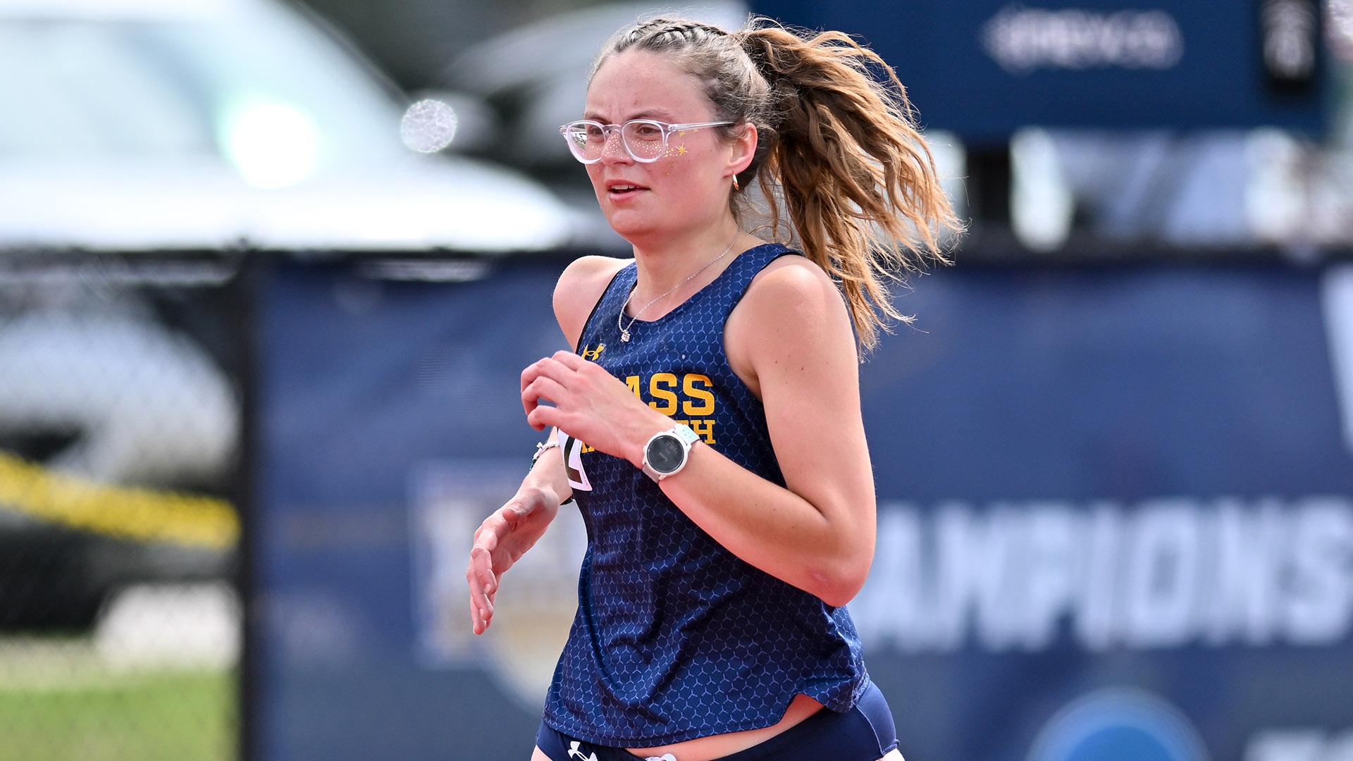 Emily Philbrook competes in the 10,000-meters at the Little East Championships