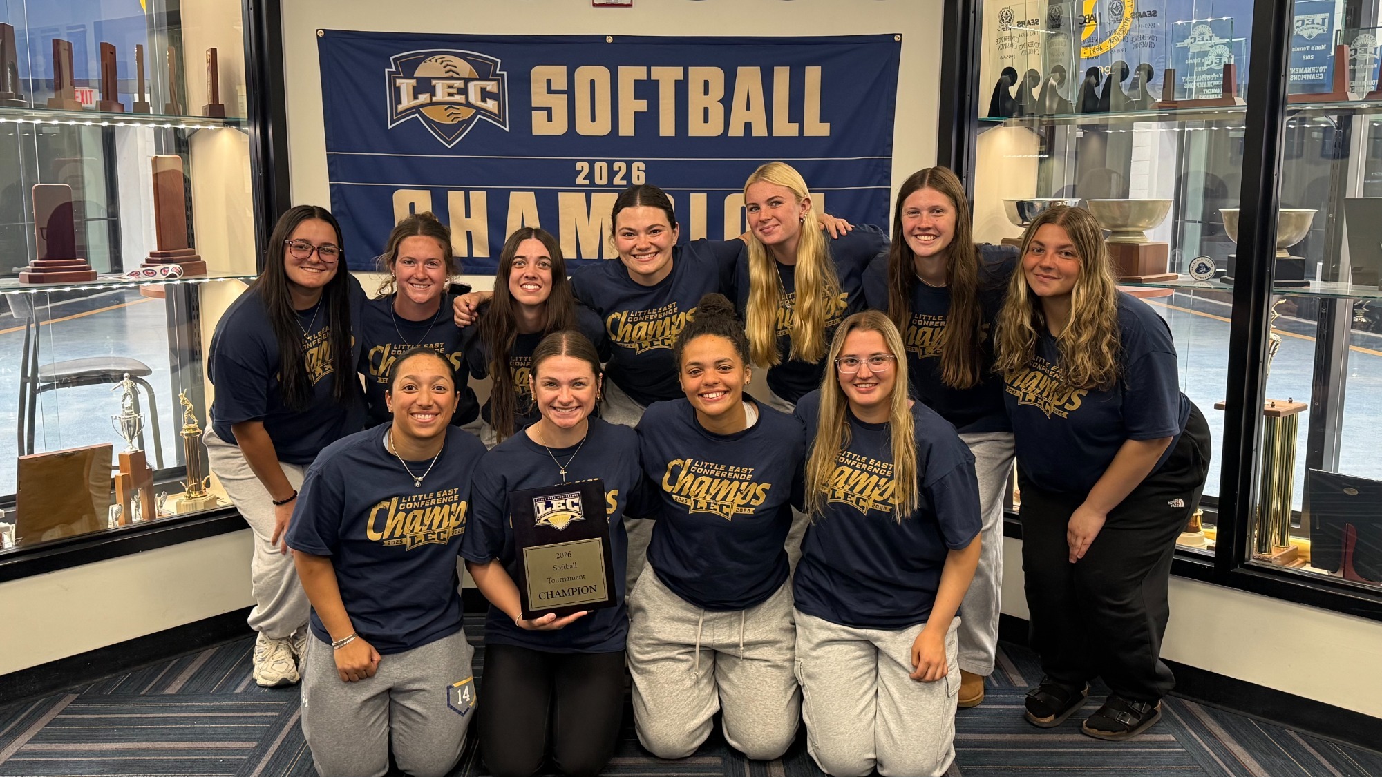 Softball poses with the LEC Champion Trophy after the NCAA Softball Tournament selection show