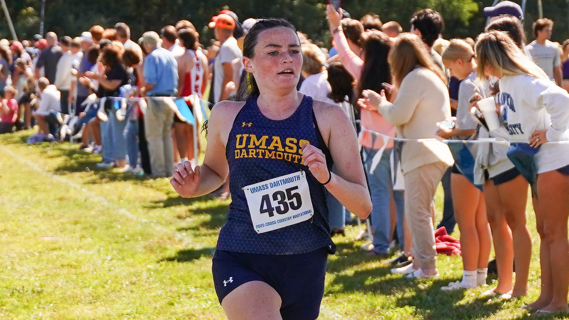 Senior Sarah Lynch crosses the finish line at the 2025 UMD Cross Country Invitational