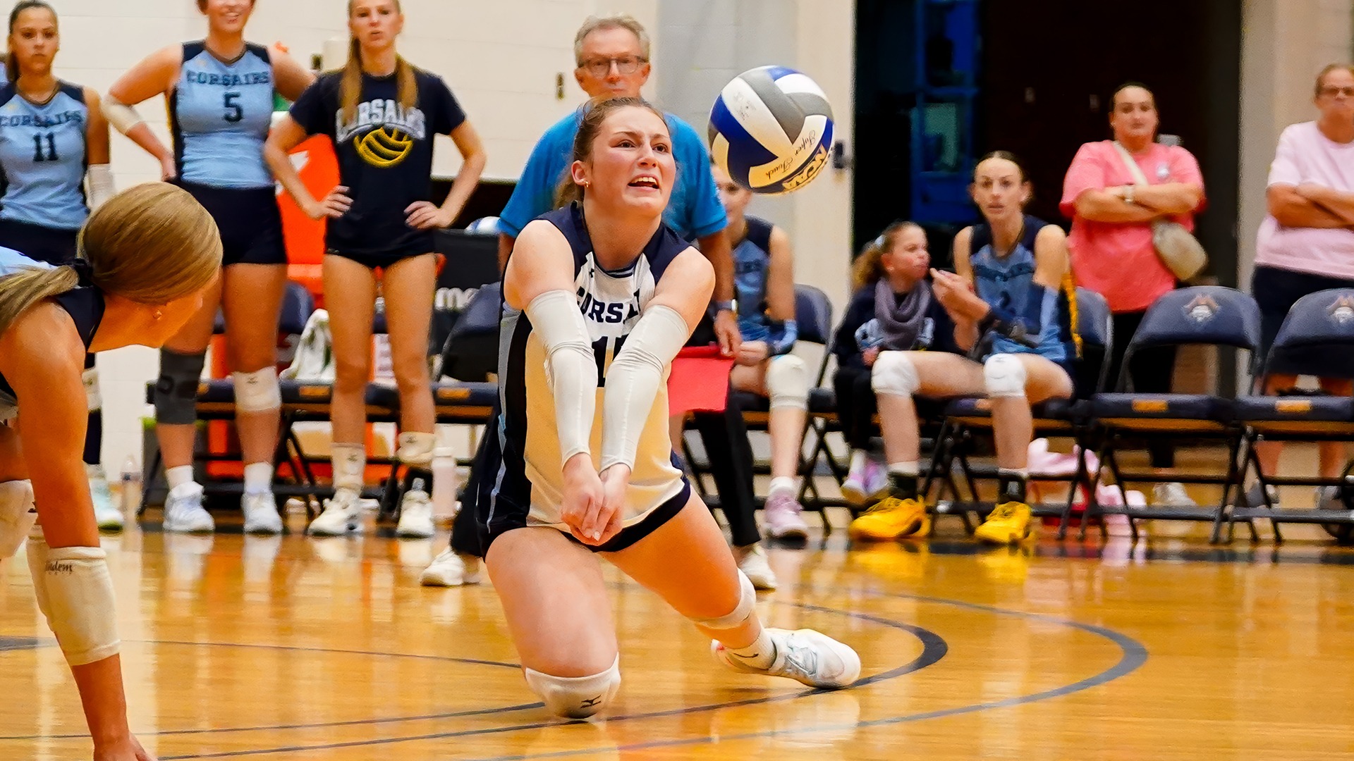Brooke Harrington goes for a dig in volleyball against Wheaton