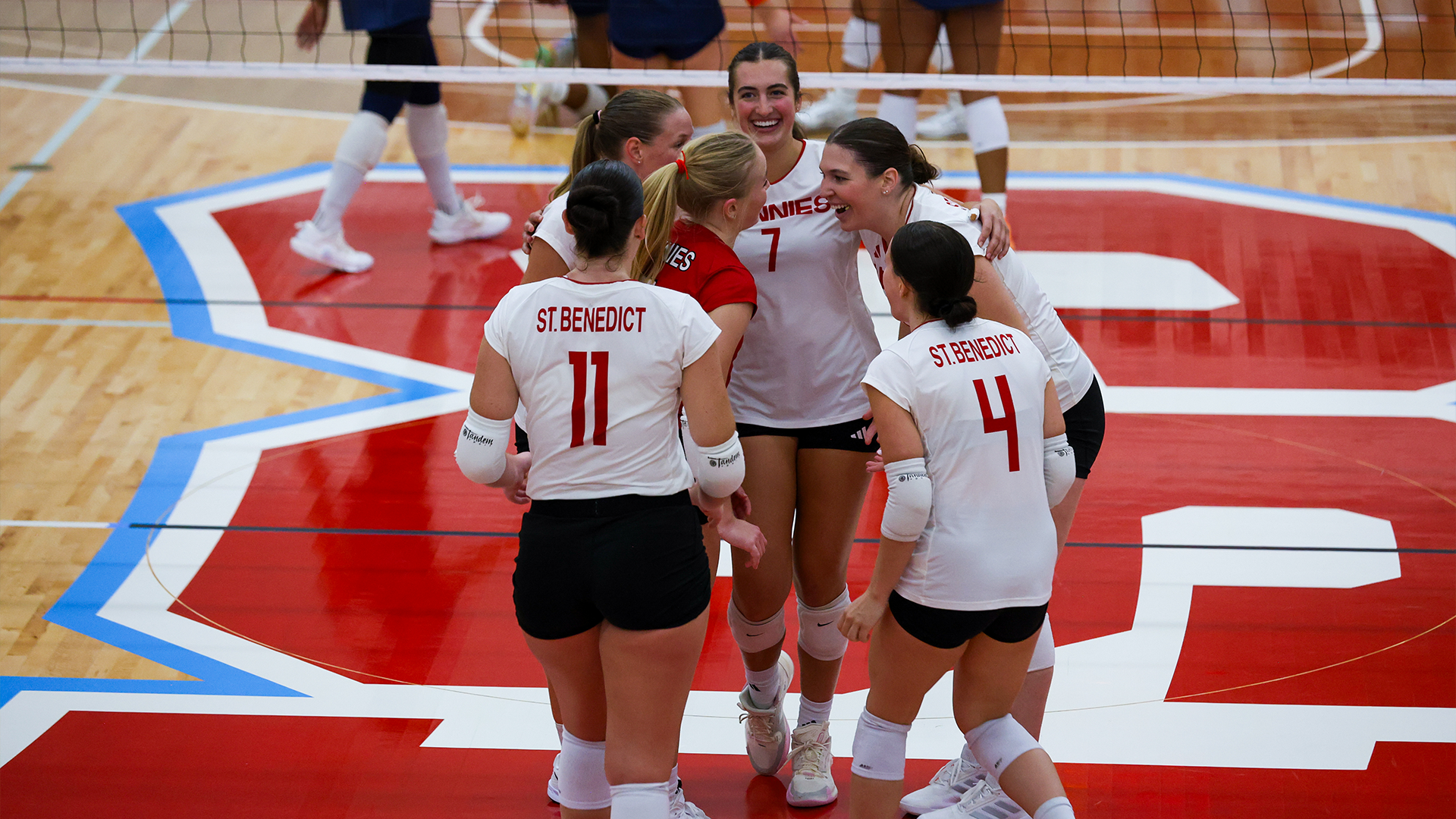 Volleyball celebrates a point against Macalester Oct. 2, 2026