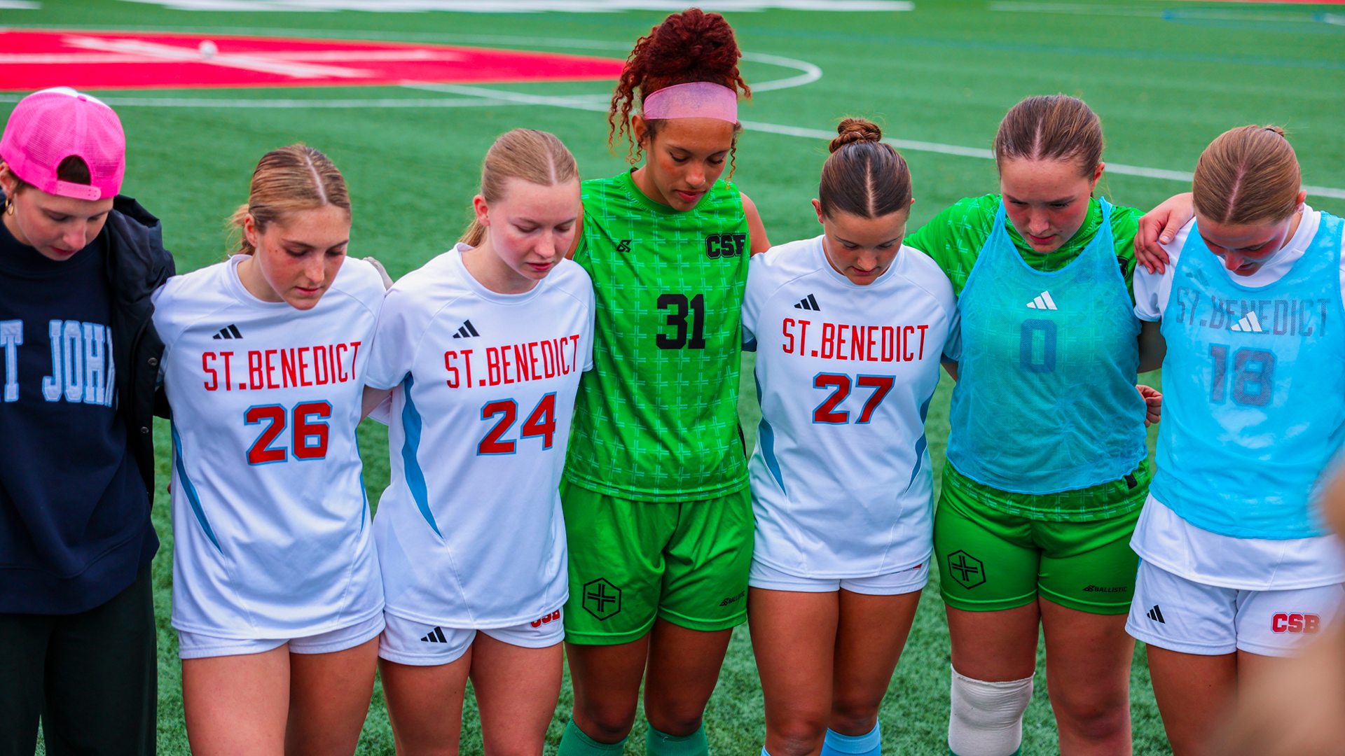 Soccer team huddle before Hamline match Oct. 14, 2026