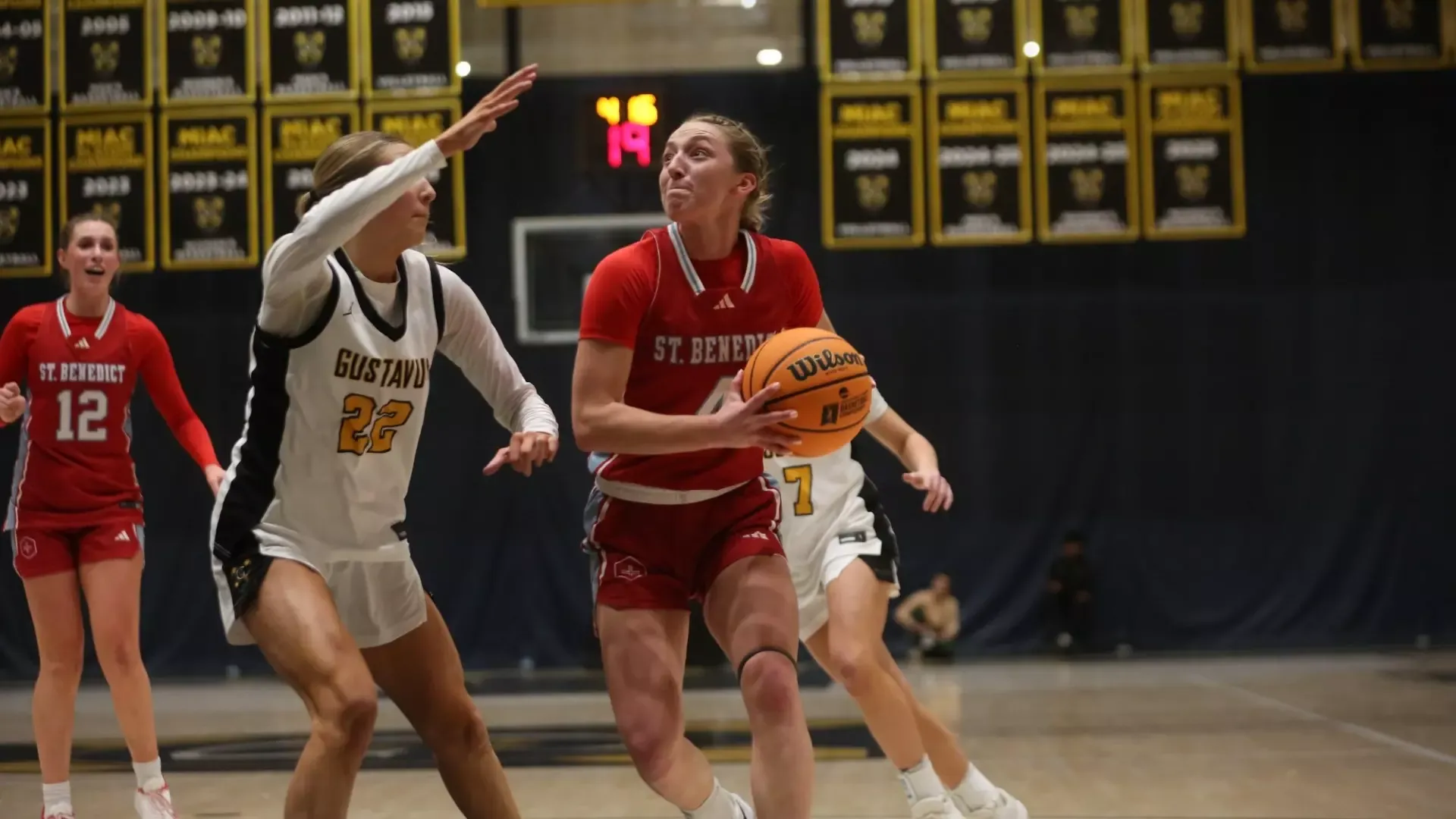Alyssa Sadlovsky drives ball against Gustavus Adolpus on Feb. 4, 2026