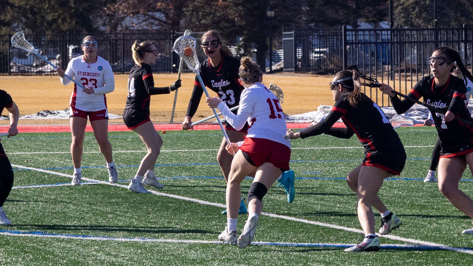 Rayna Malmberg  attacks while Annabella Brisk is prepared to assist vs Edgewood - Lacrosse