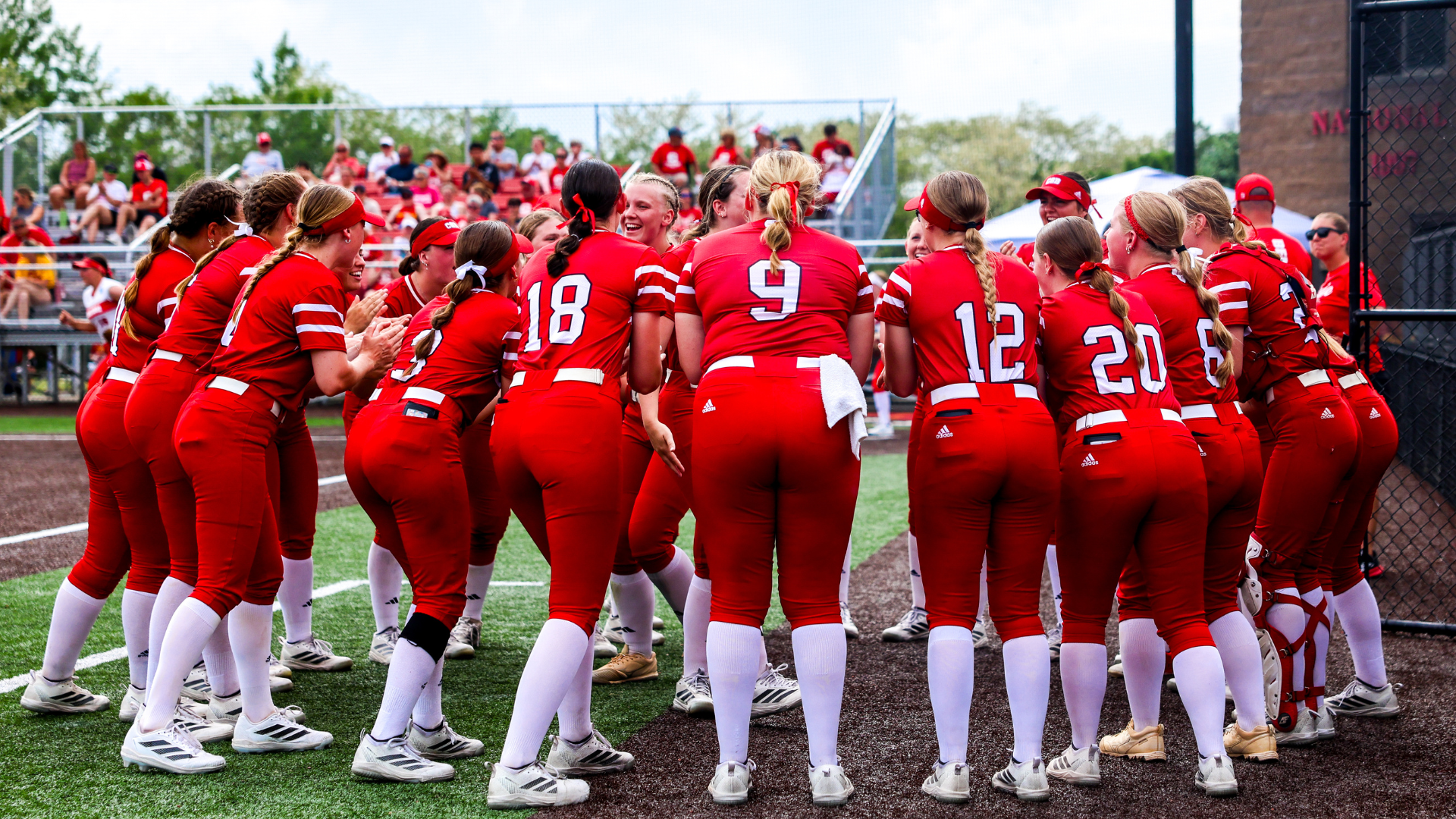Softball pregame huddle before facing Central in the 2026 NCAA tournament regional