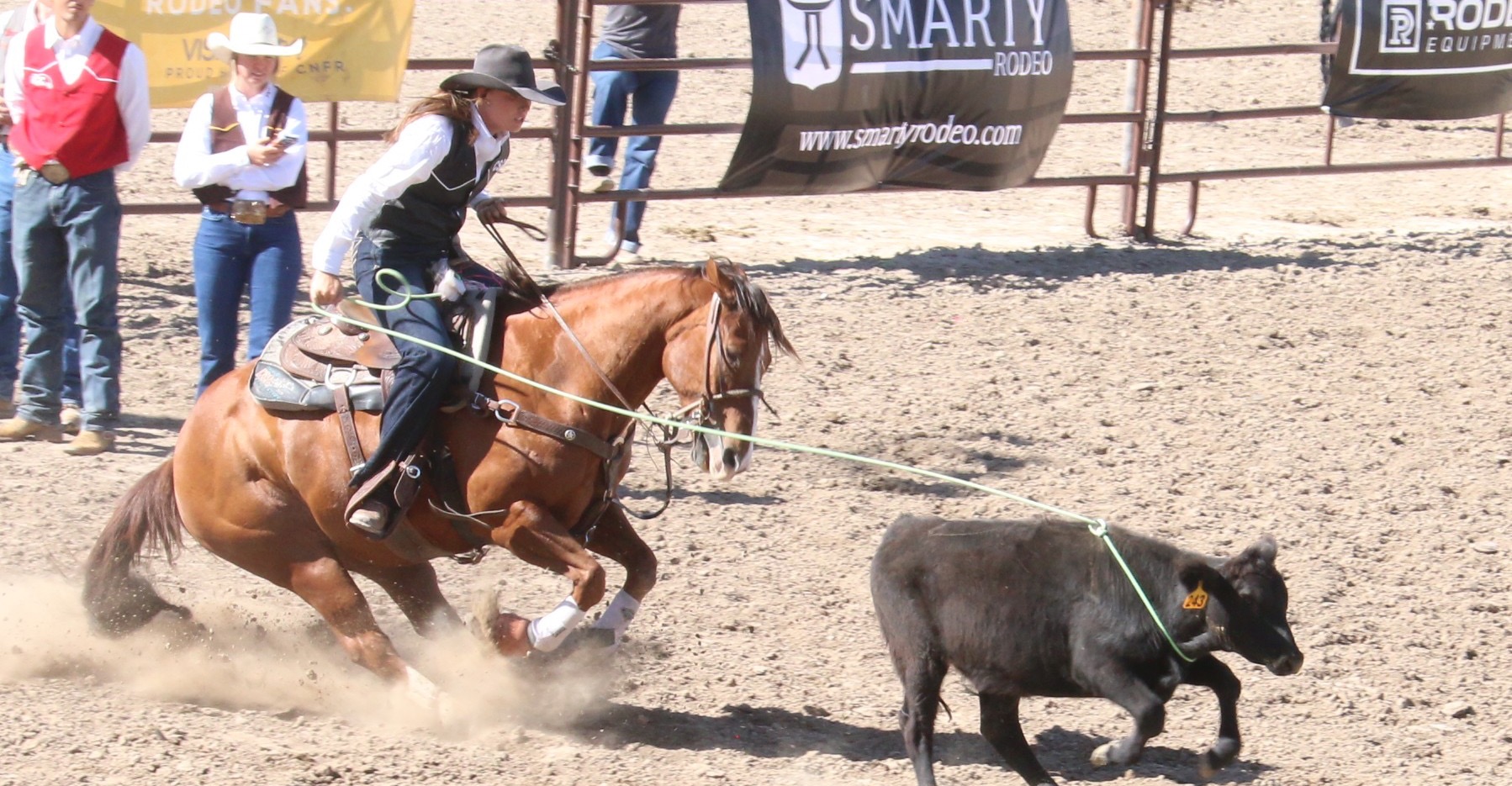 Olivia Lay catches a calf at the Chadron rodeo