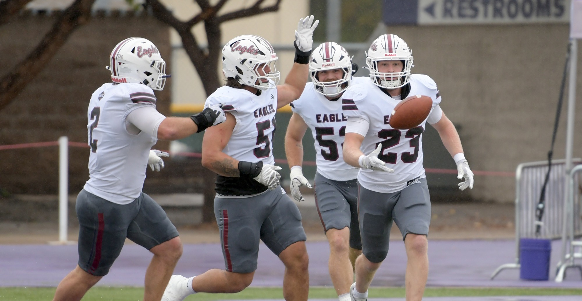 Liam Blaser celebrates pick-six with teammates vs. NMHU