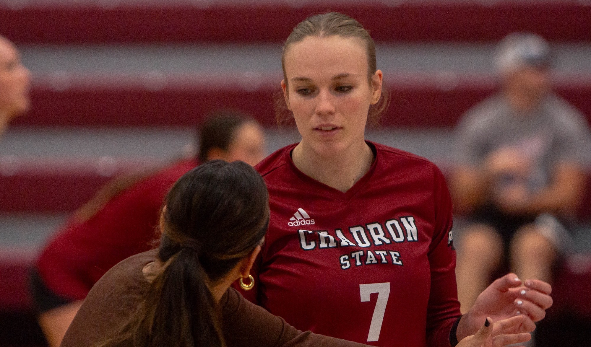 Kally Kirkwood listening to Coach Stadler