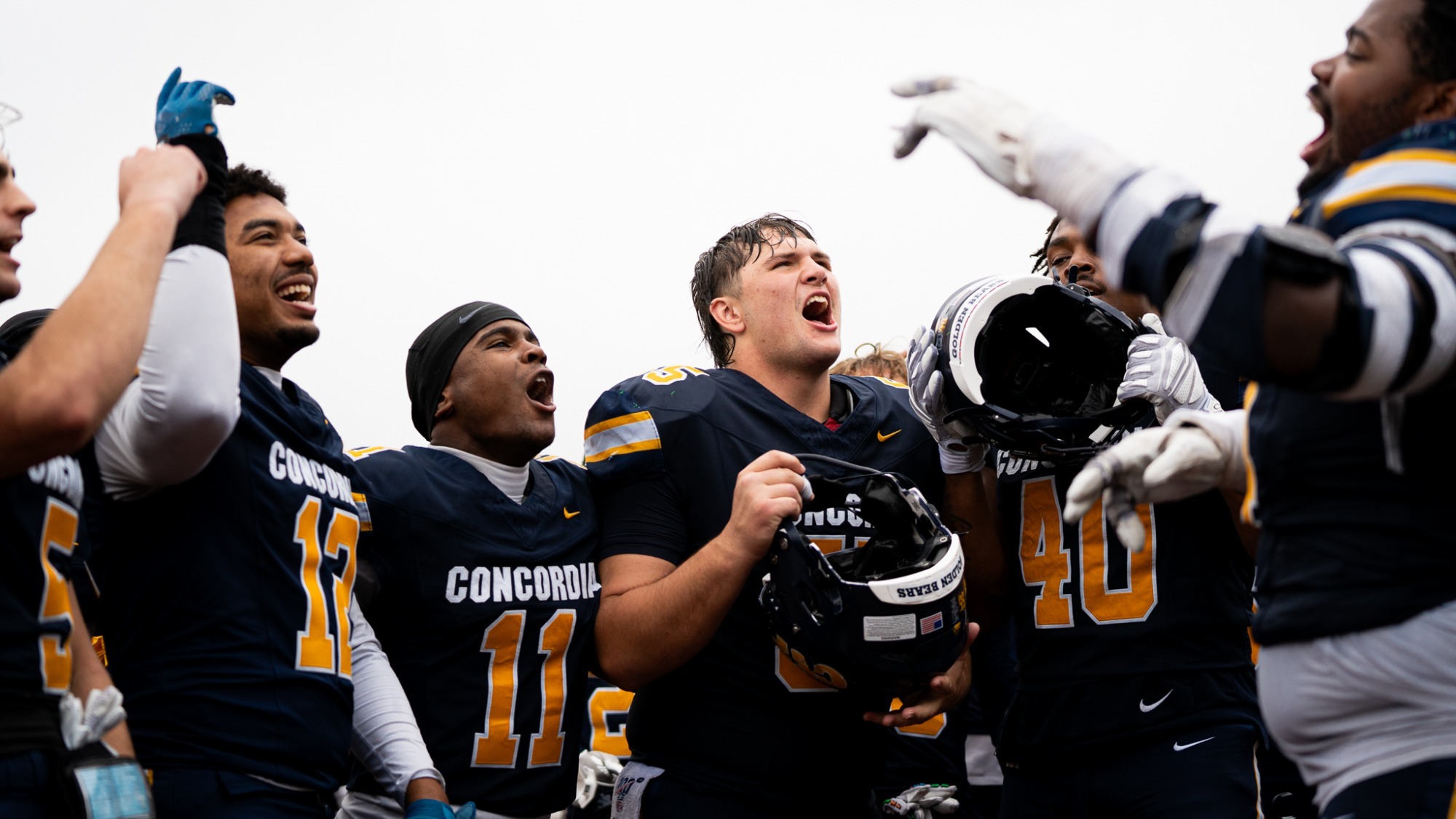 Football team celebrate 2026 vs BSU
