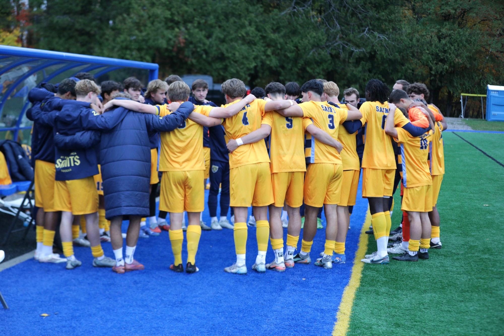 Men's soccer huddle