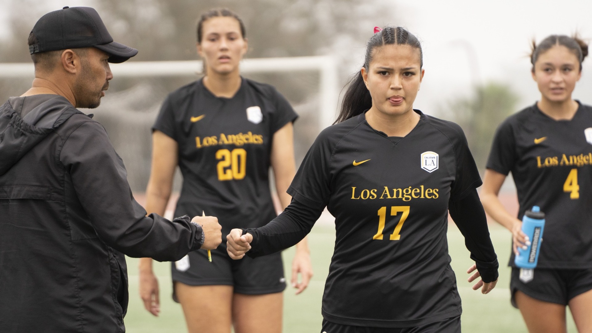 celine gehrig walks off the field of halftime in recent game