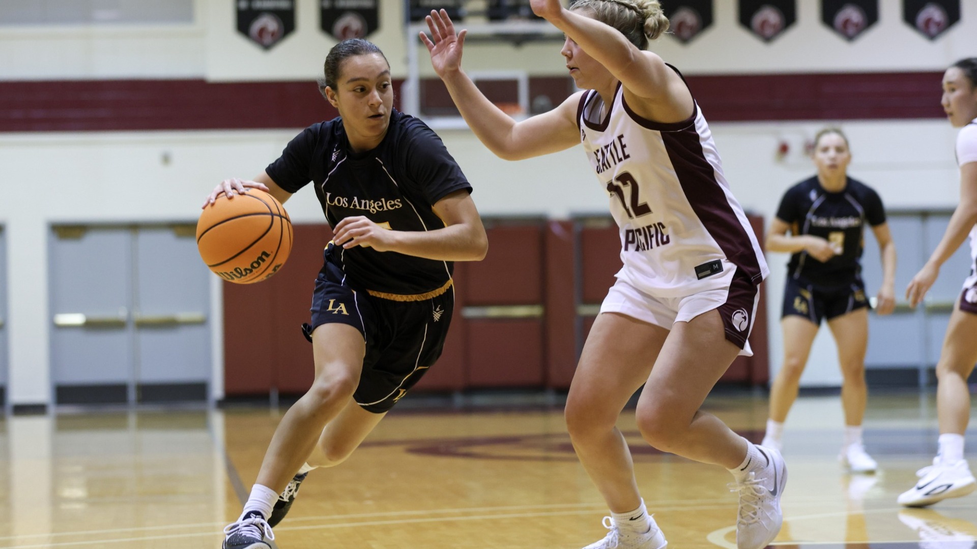 sofia fidelus drives to the basket against seattle pacific