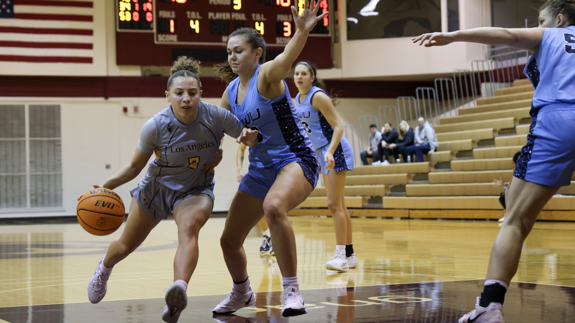 ariyah smith dribbles against defenders