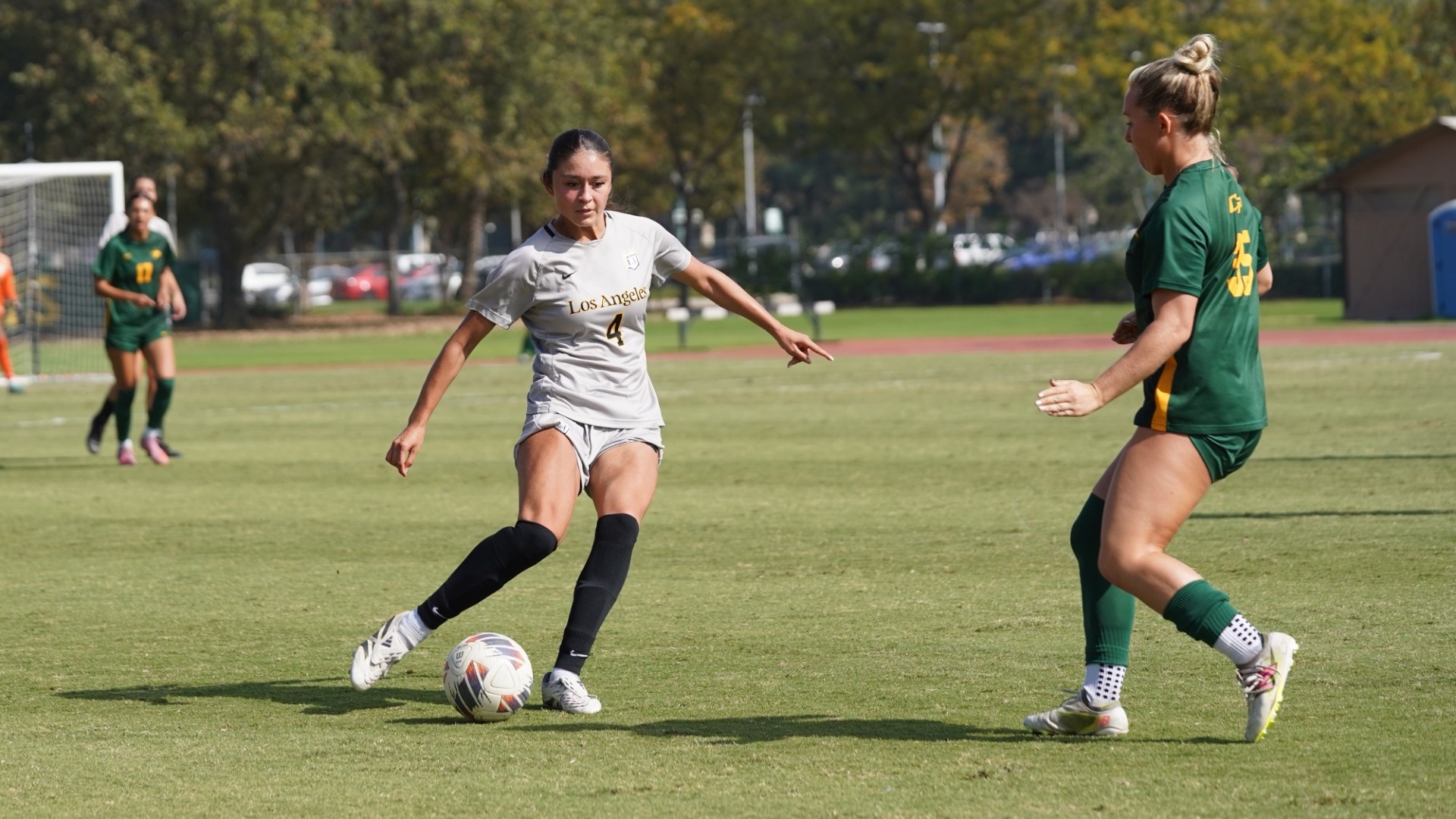 camila juarez dribbles upfield against cal poly pomona