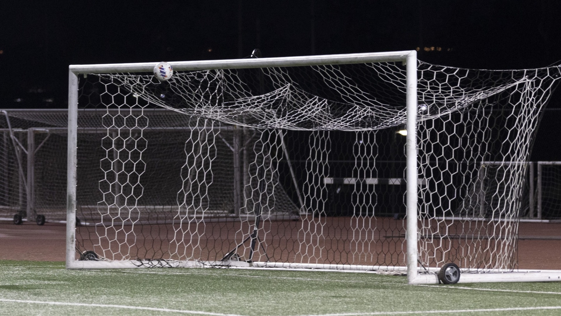 soccer ball goes into the goal
