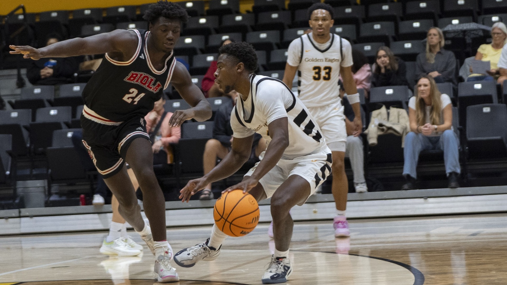 michael pearson jr. dribbles against defender