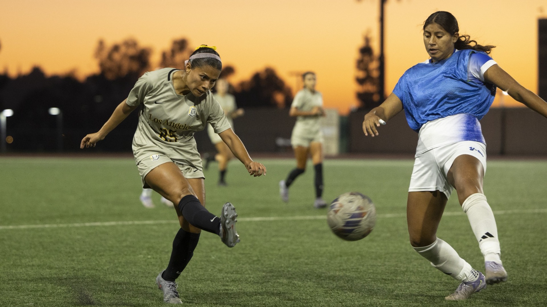 jacqueline marin takes a shot against a cal state san bernardino defender
