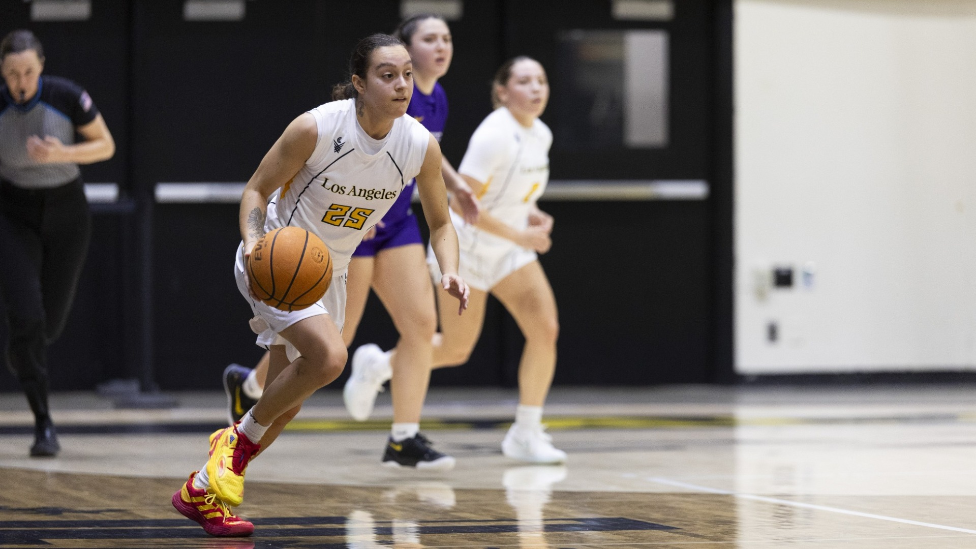 sofia fidelus dribbles upcourt against san francisco state