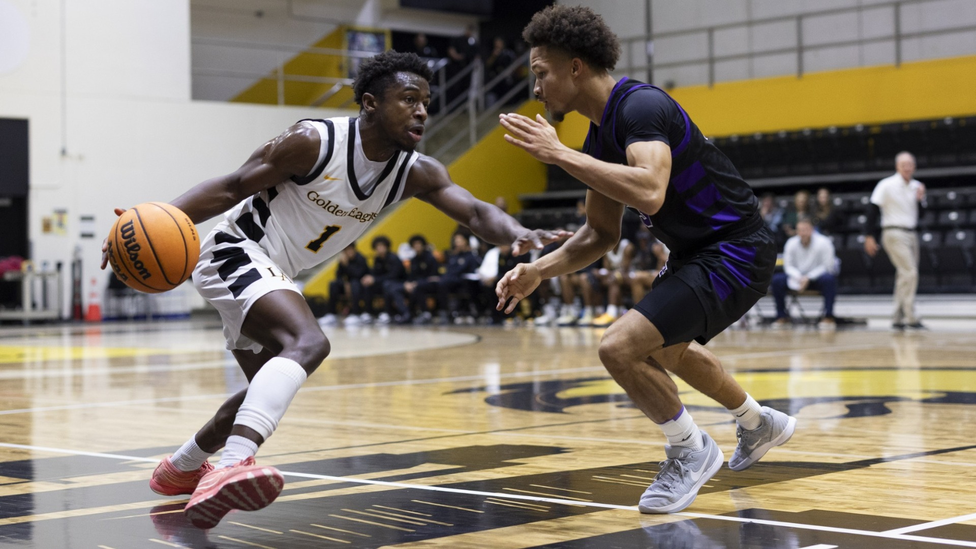michael pearson dribbles against defender
