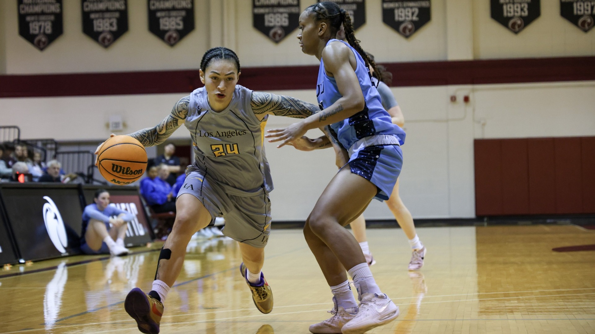 nevaeh asiasi drives against a defender
