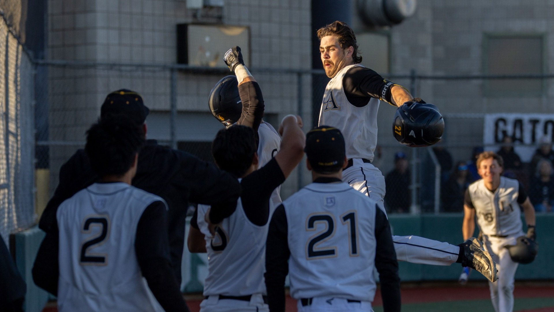carson panarisi celebrates with teammates after go-ahead home run
