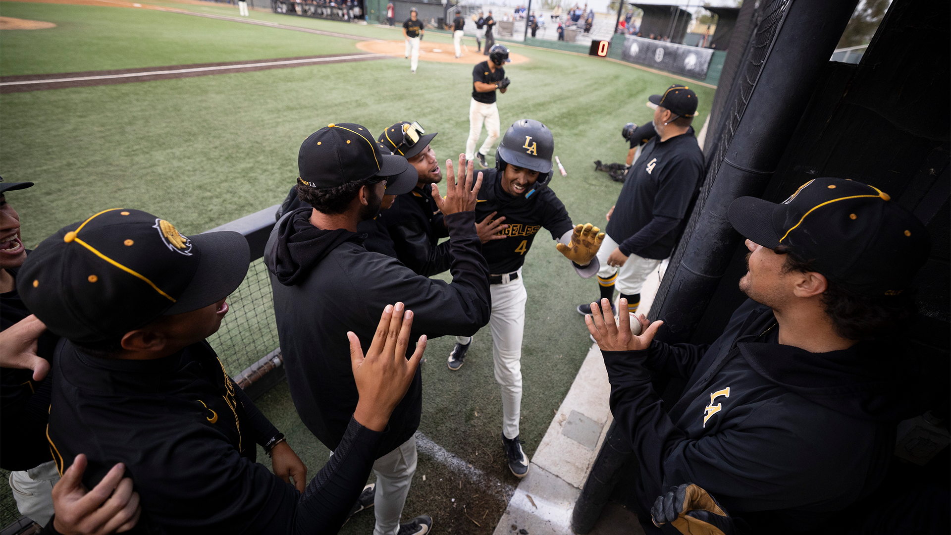 kadyn victorian greeted in the dugout after a home run